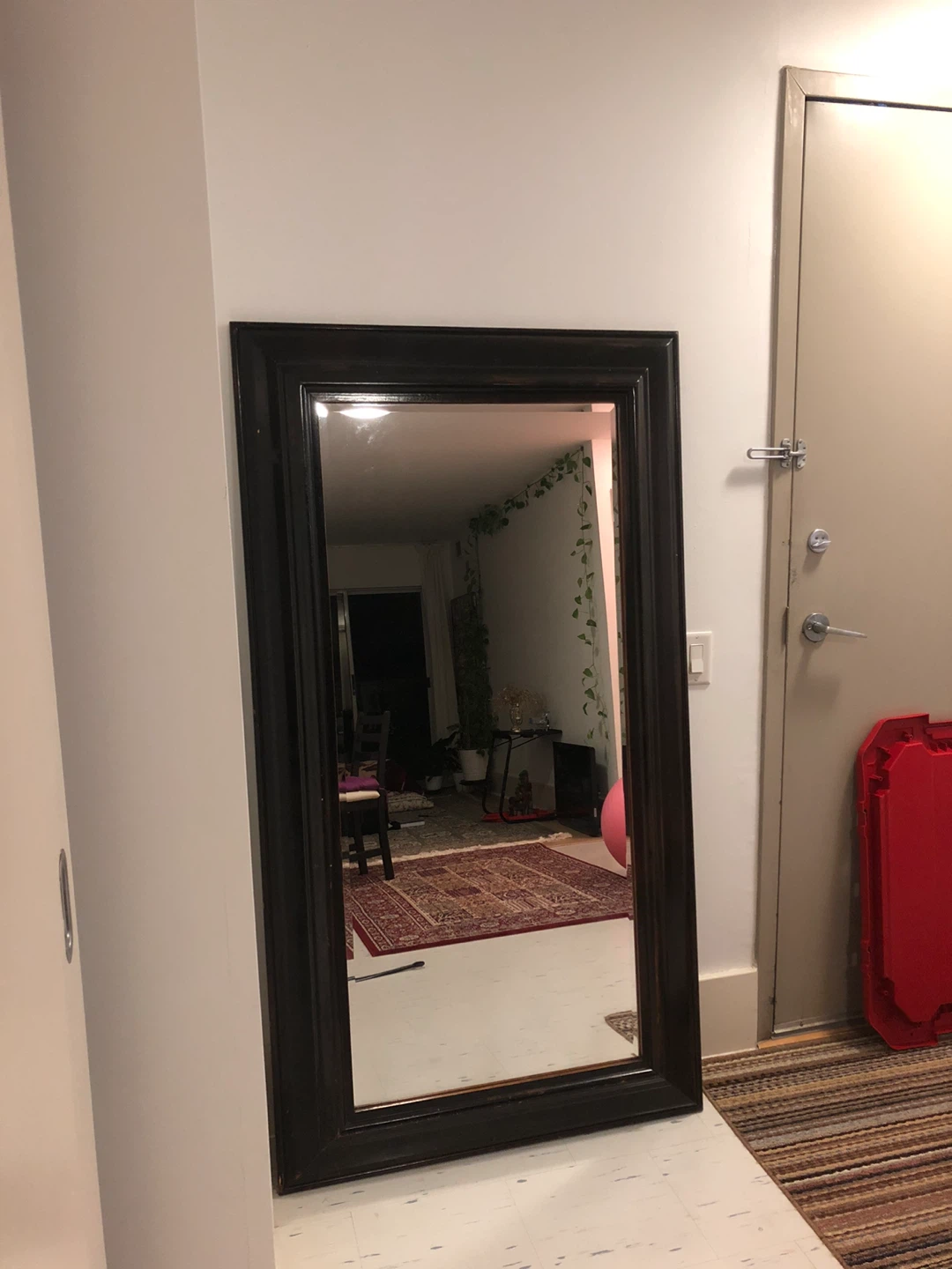 Large dark wood framed mirror