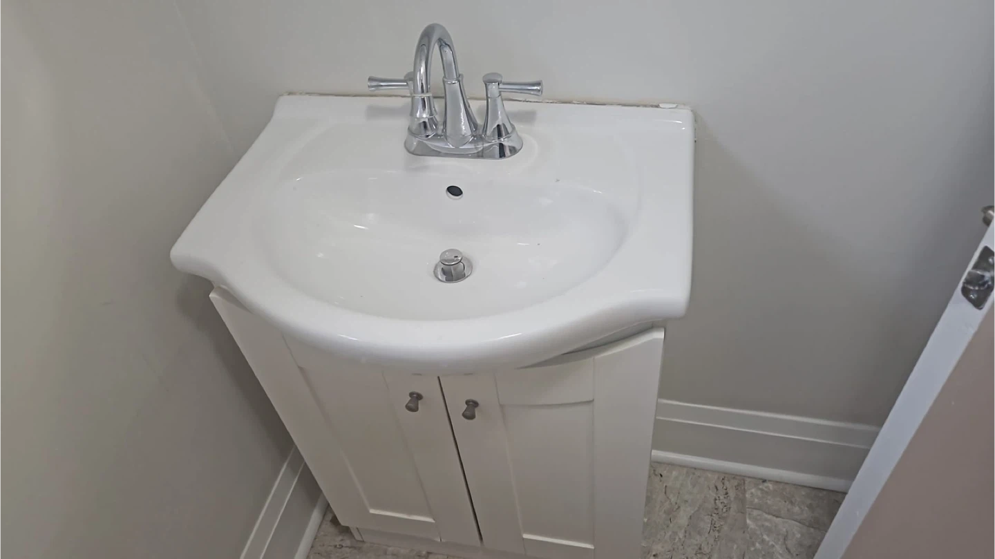 White Pedestal Bathroom Sink with Cabinet and Faucet