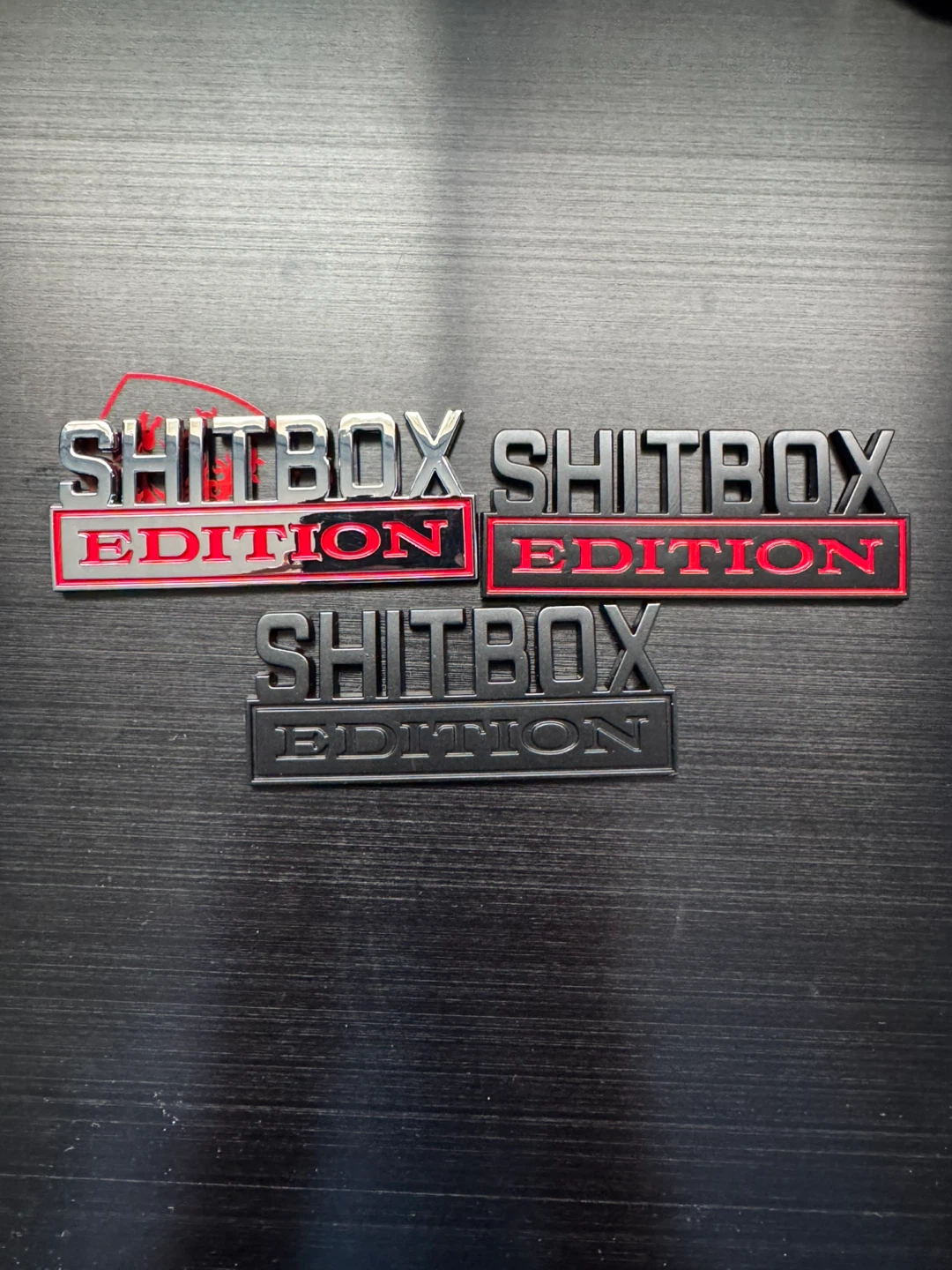 Shitbox edition car badge