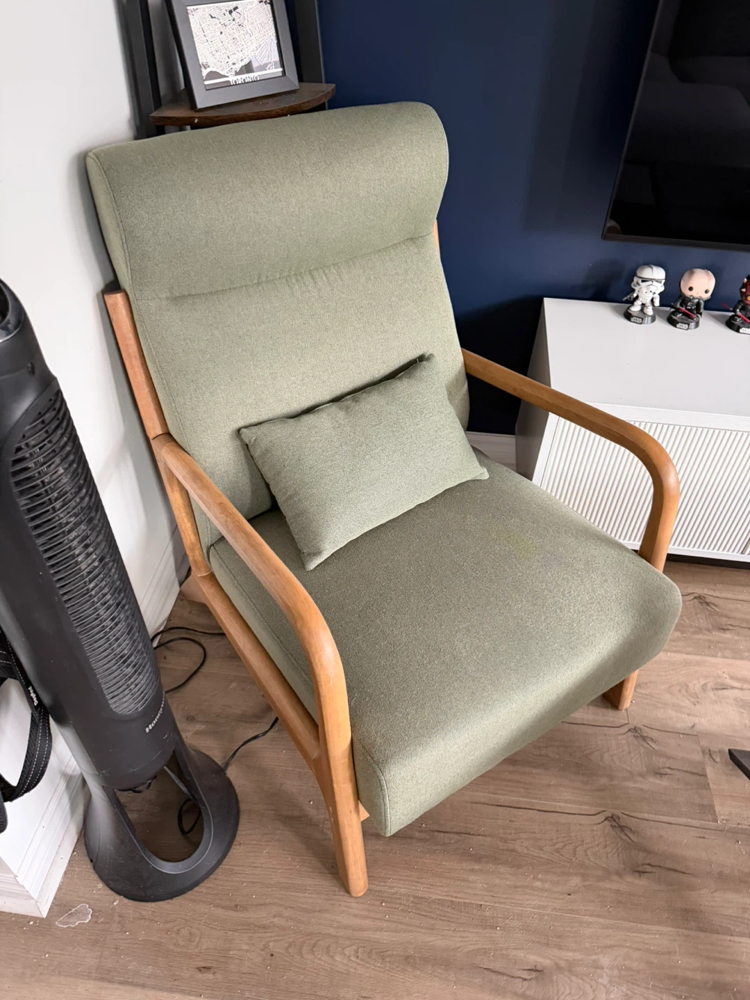 Green accent chair with wooden frame