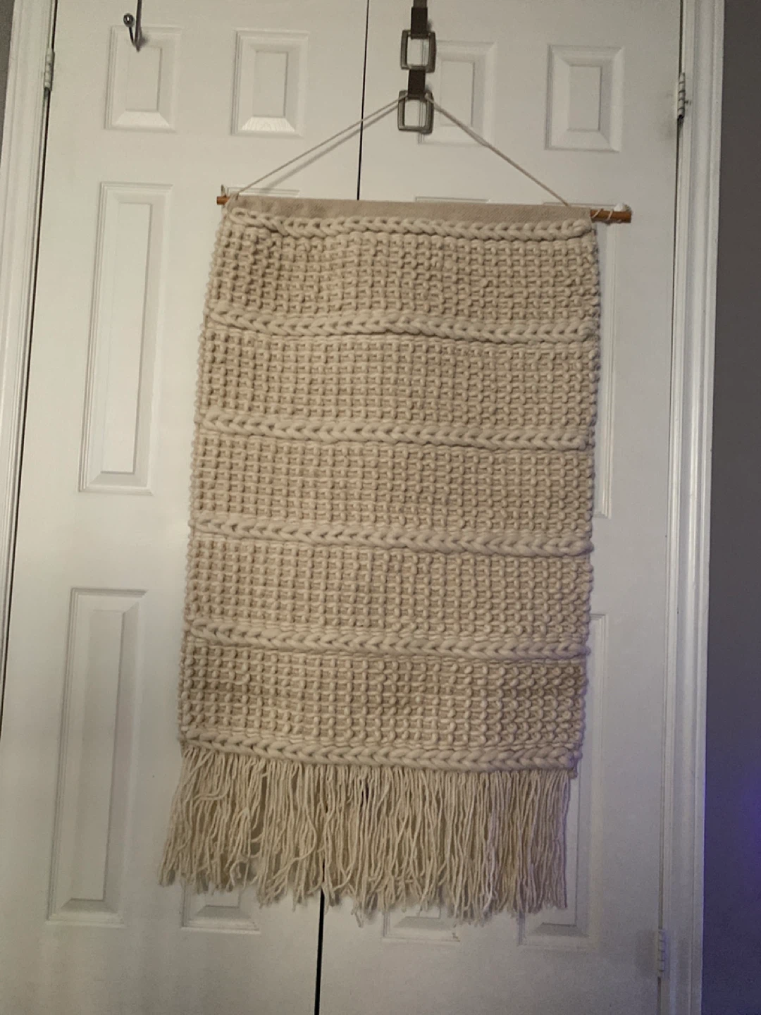 Cream macramé wall hanging with fringe