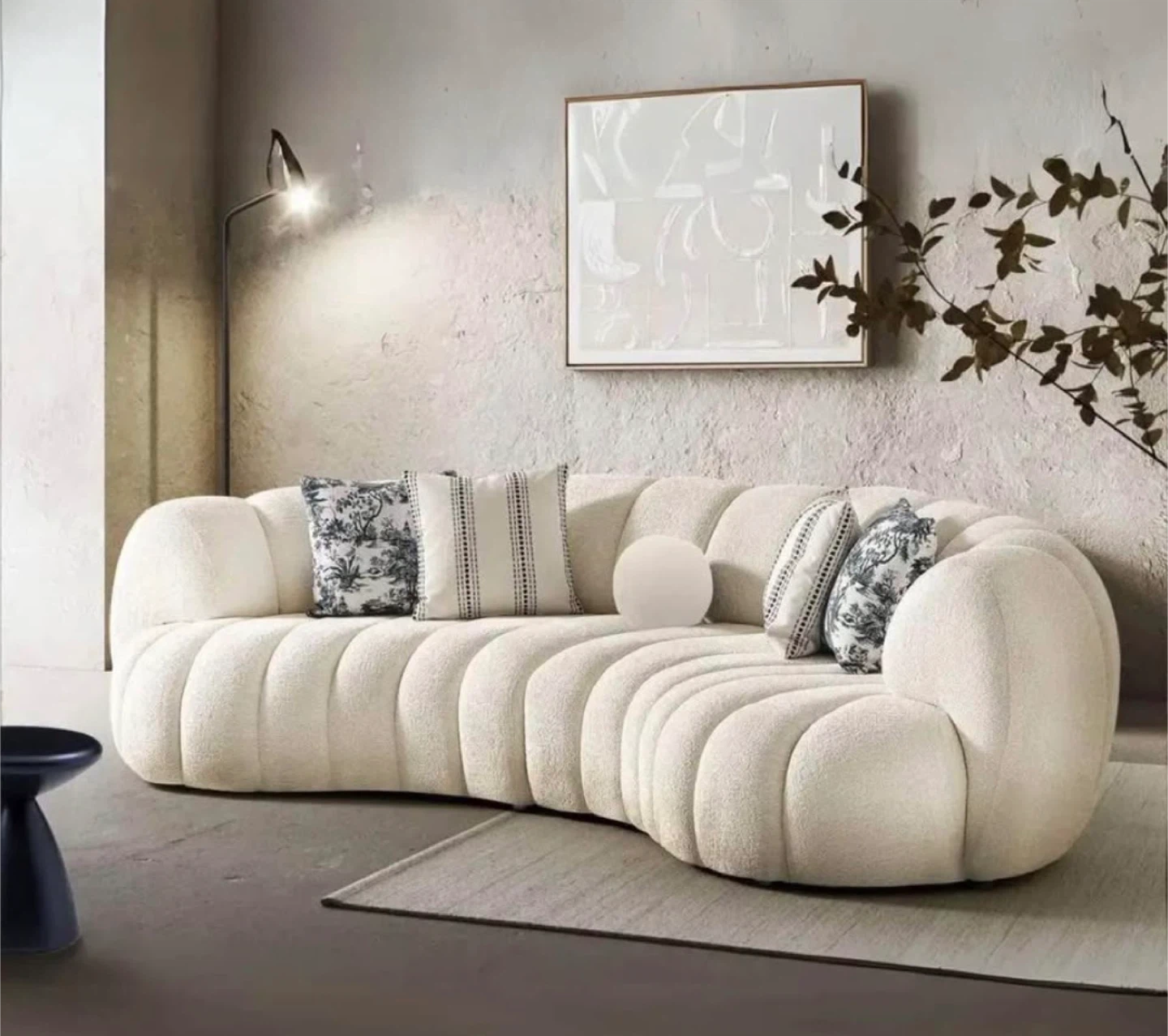 Curved Cream Bouclé Sofa with Pillows