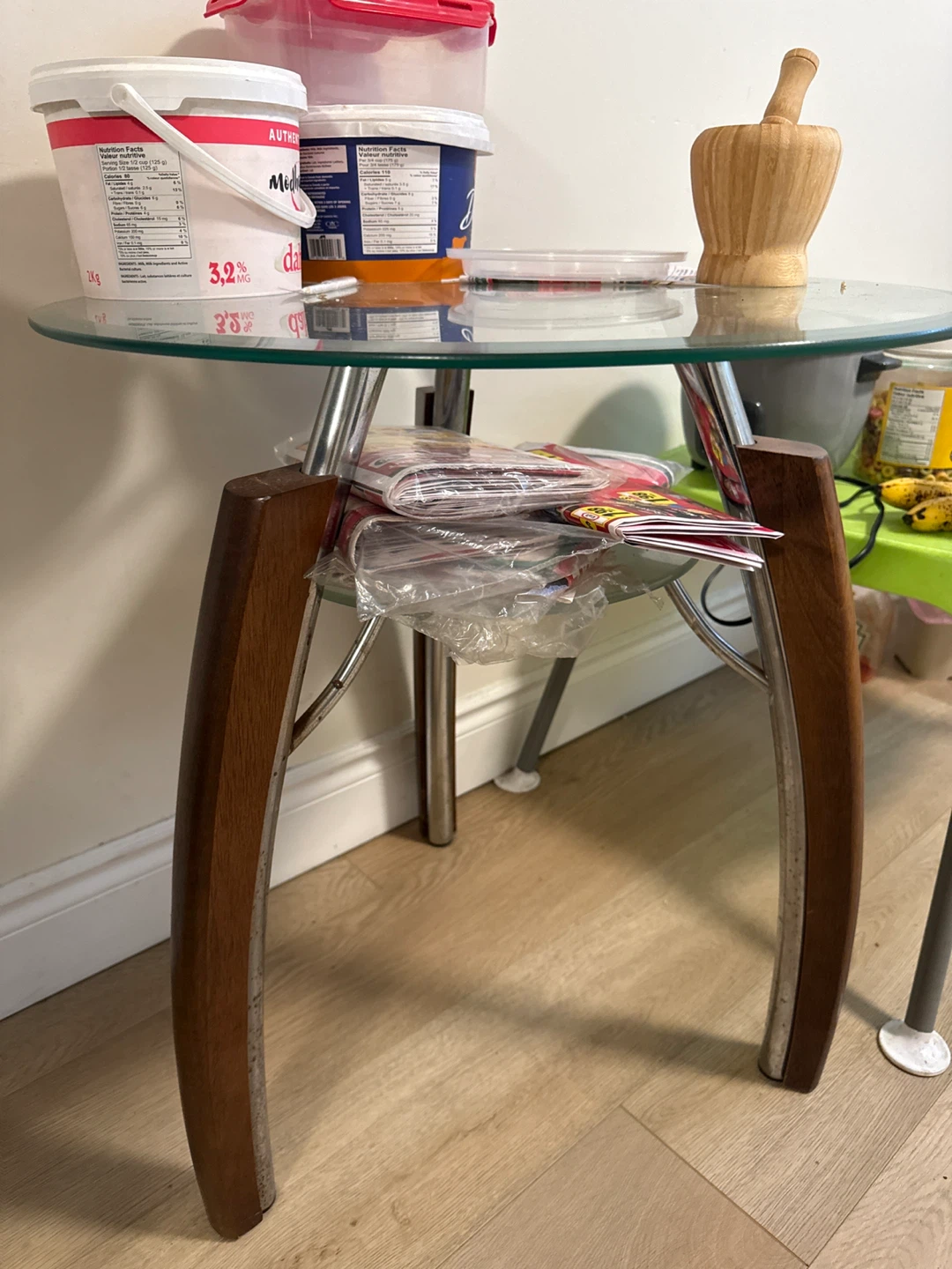 Glass top side table with wood and metal legs