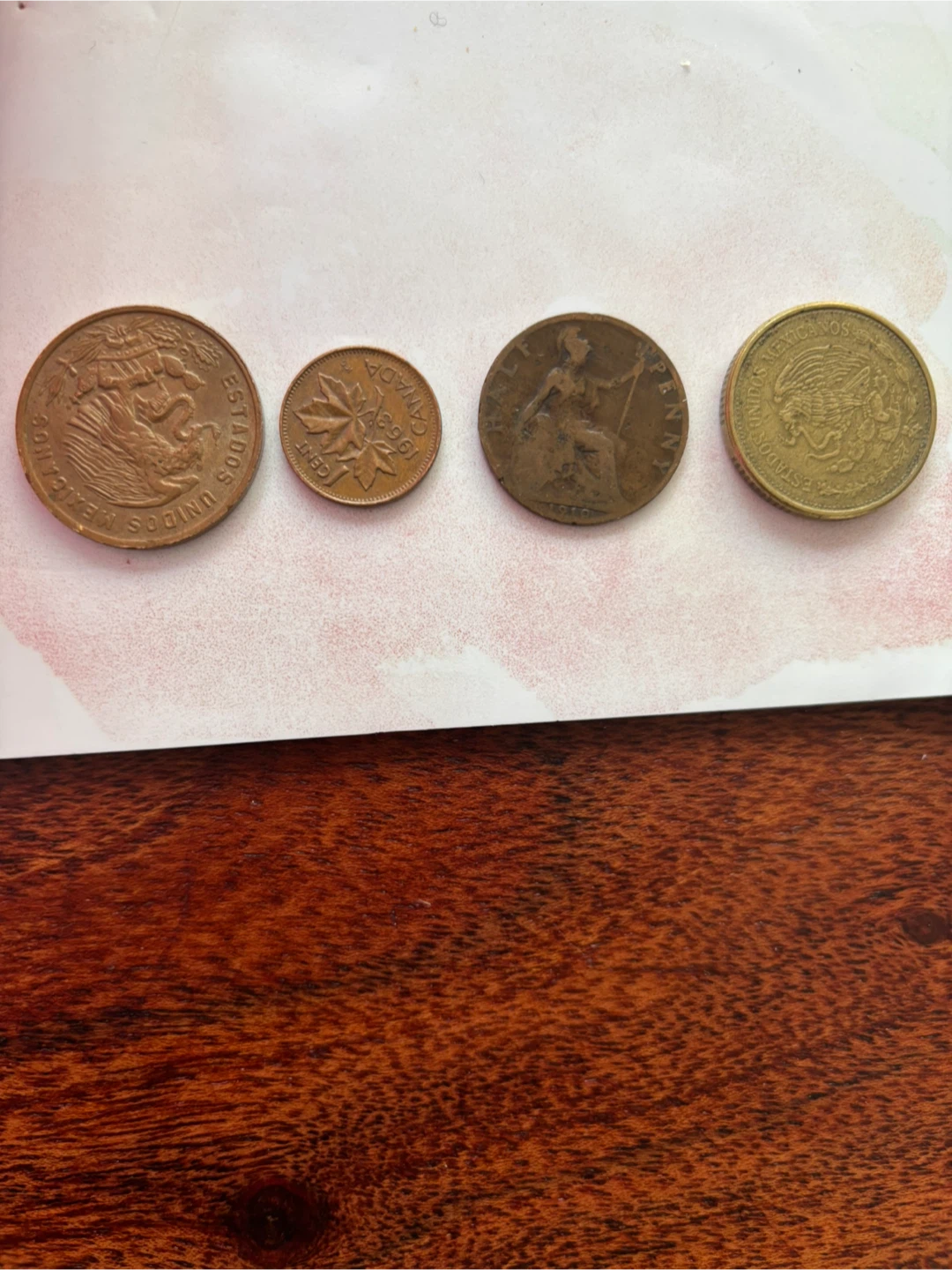 Assorted Old Coins: Canadian Penny, British Penny, Mexican Pesos