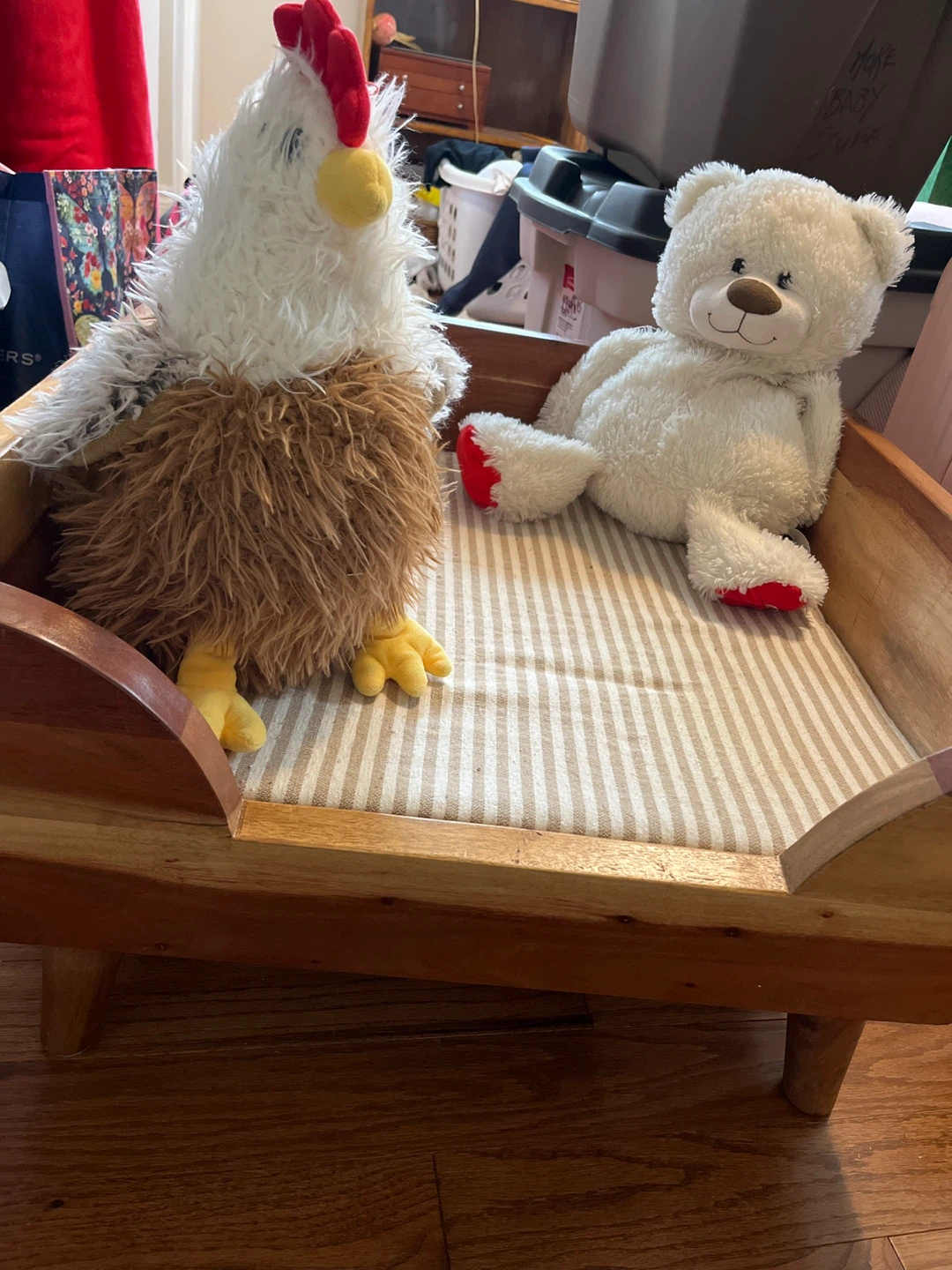 Wooden pet bed with striped cushion