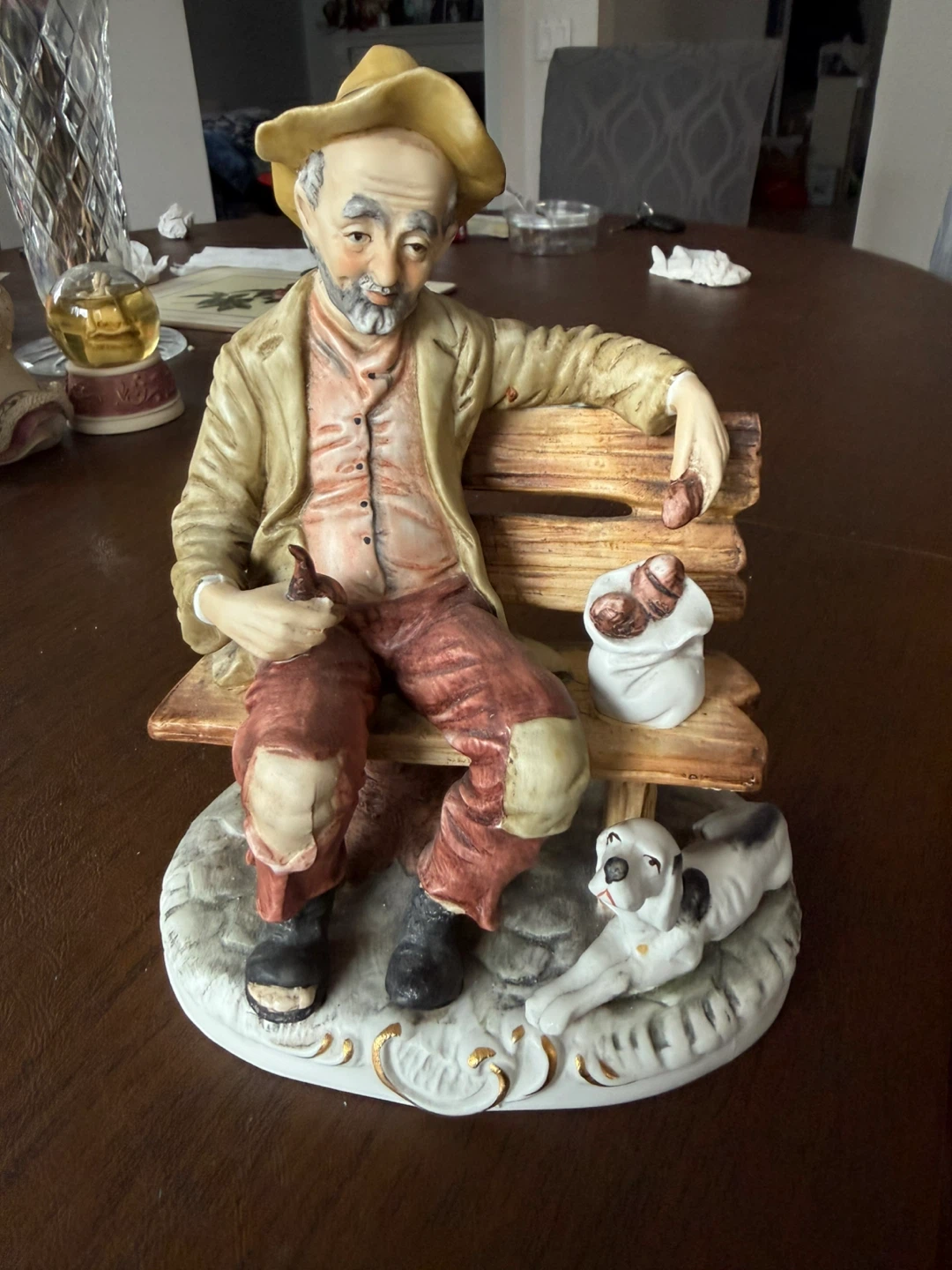 Ceramic Figurine of Man on Bench with Dog