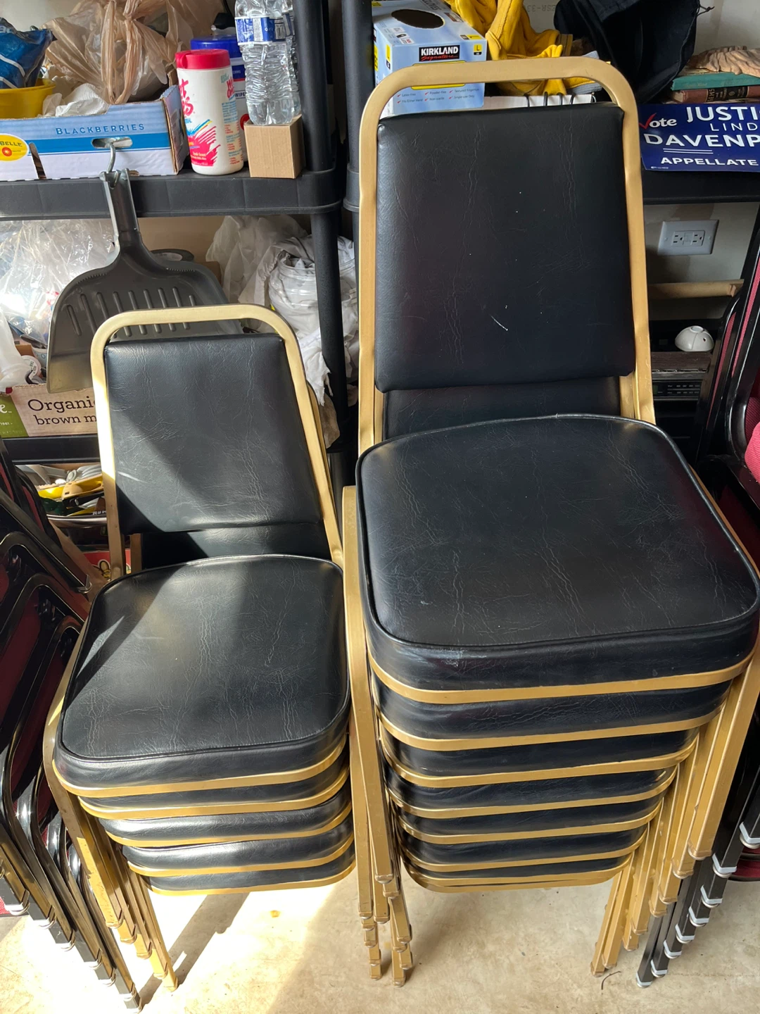 15 stackable black cushion metal frame chairs. $10 each.