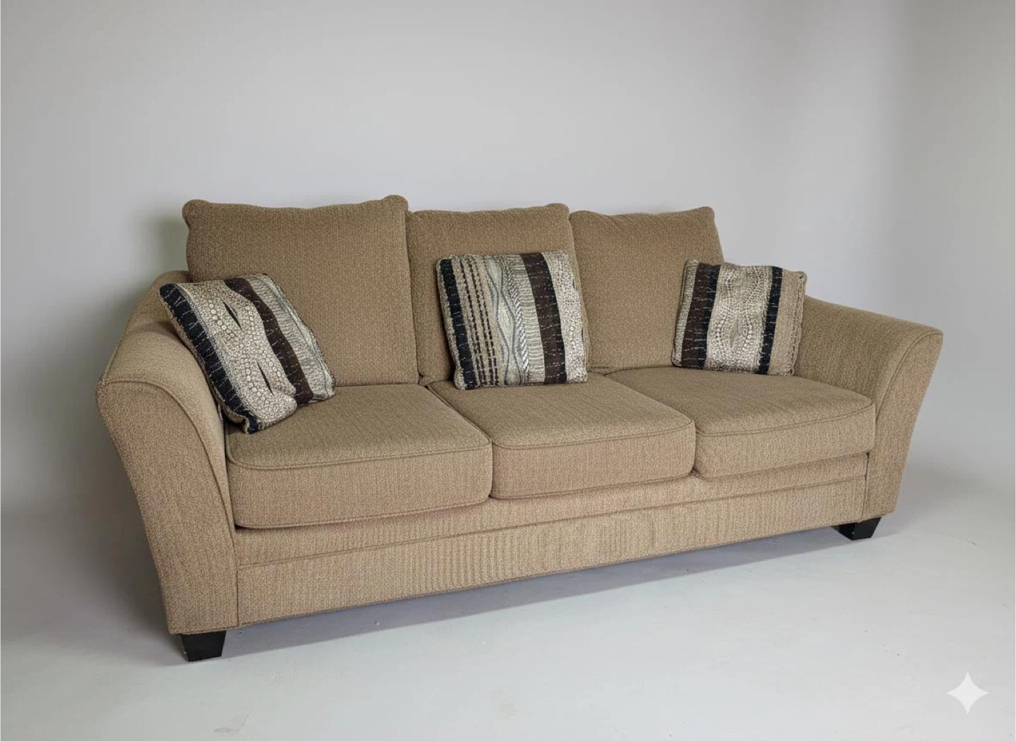 Tan Sofa with Decorative Pillows and solid wood dining table