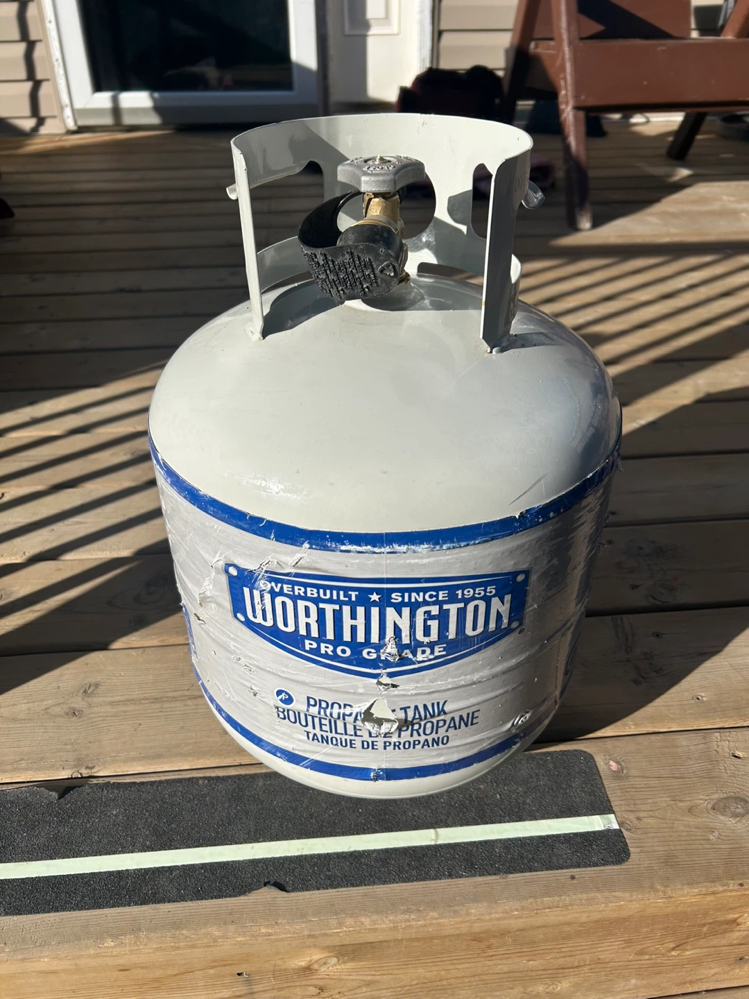 20 Lb propane tank / half full