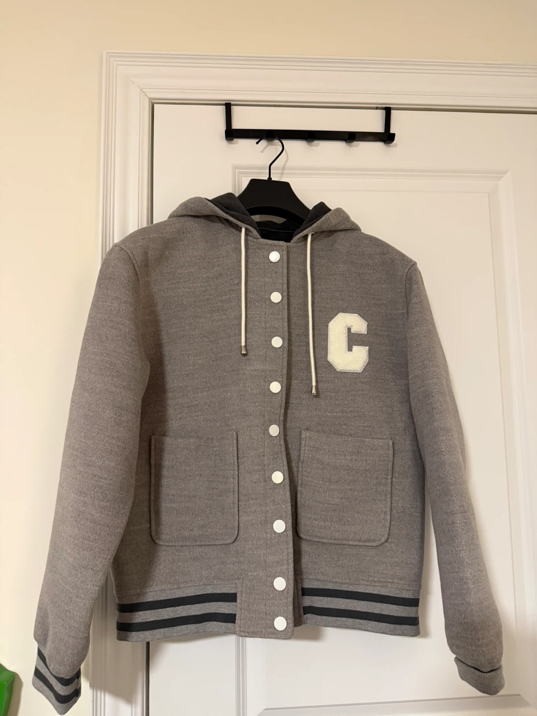 Grey hooded varsity jacket with 'C' patch