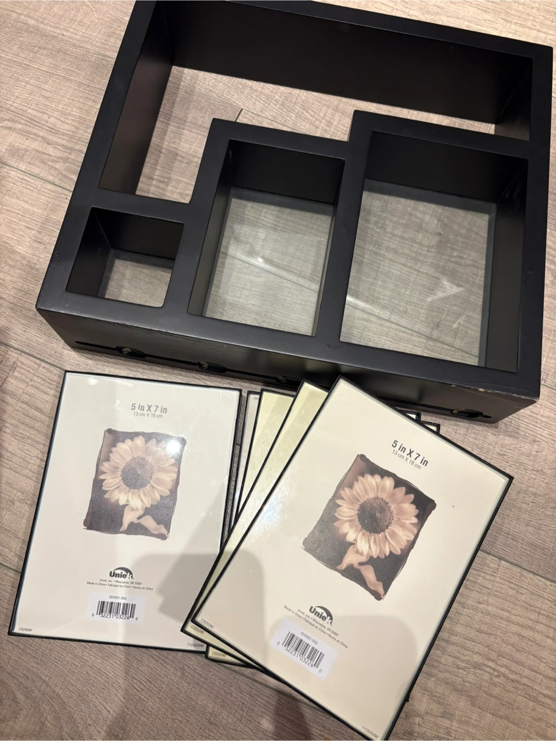 Black tiered frame and 4 picture frames