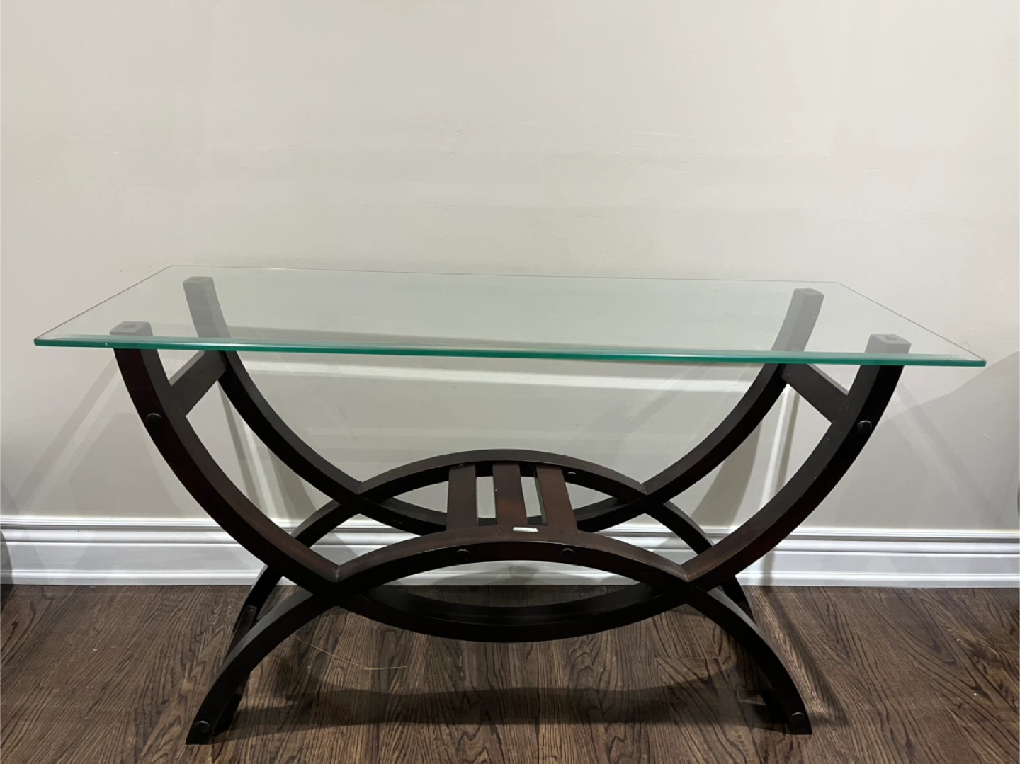 Glass top console table with dark wood base