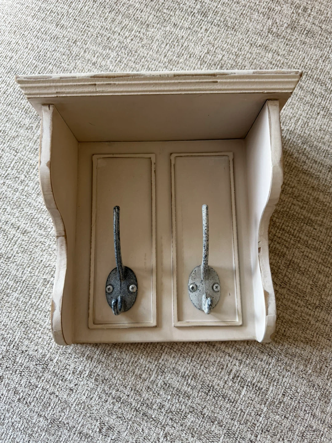 Small solid wood shelf with two large metal hooks