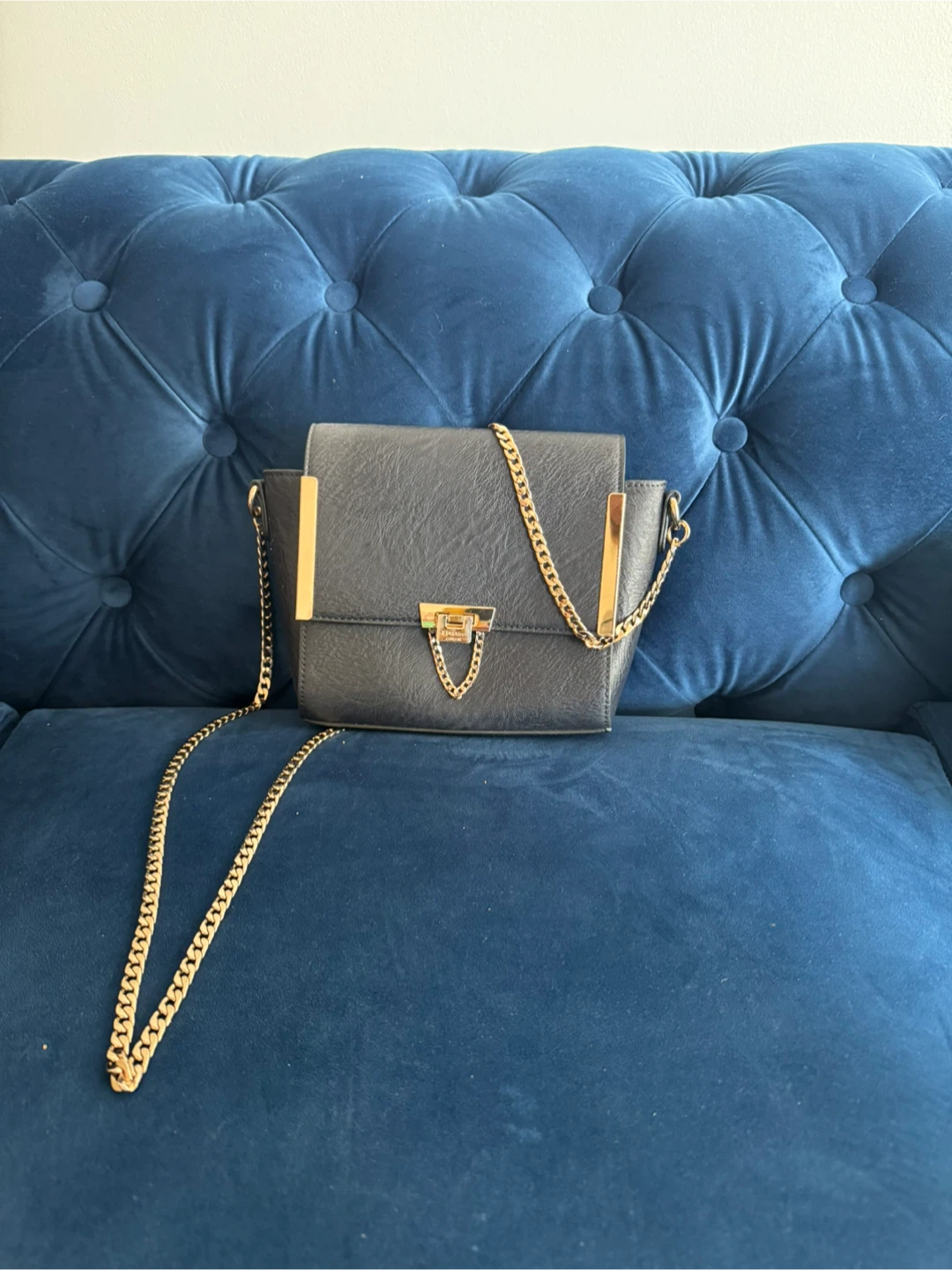 Black crossbody bag with gold chain strap