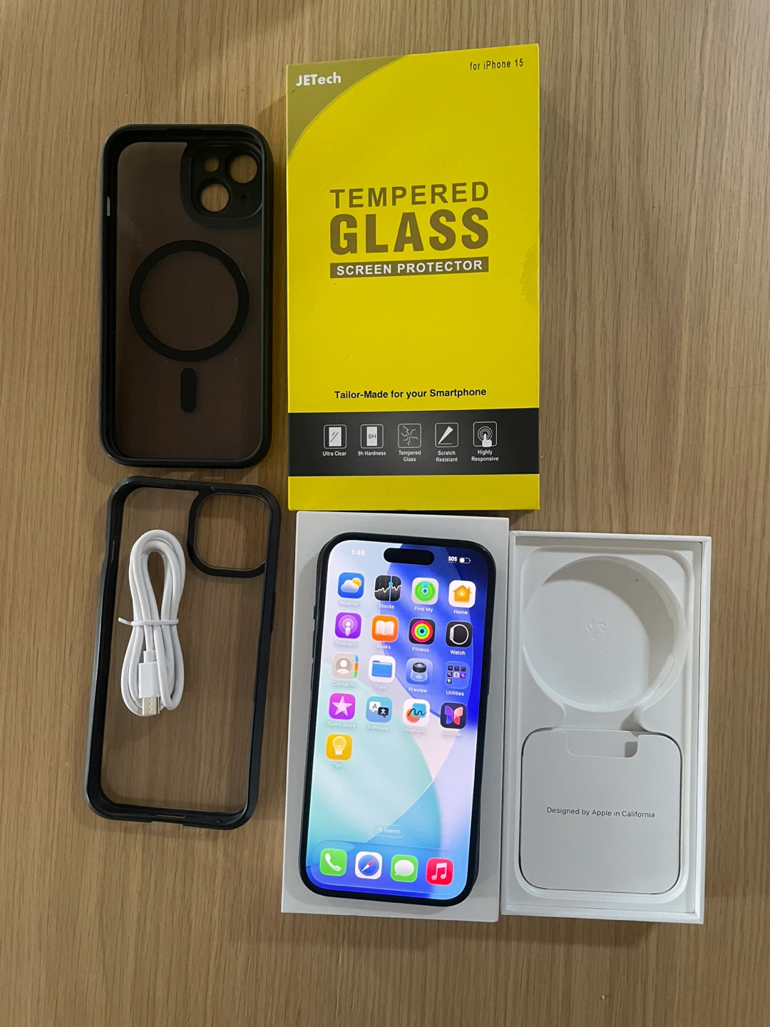 MINT iPhone 15 with Case and Screen Protector