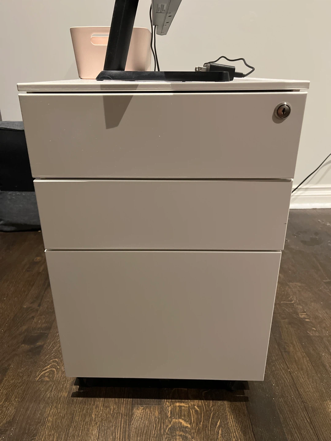 White metal filing cabinet with lock