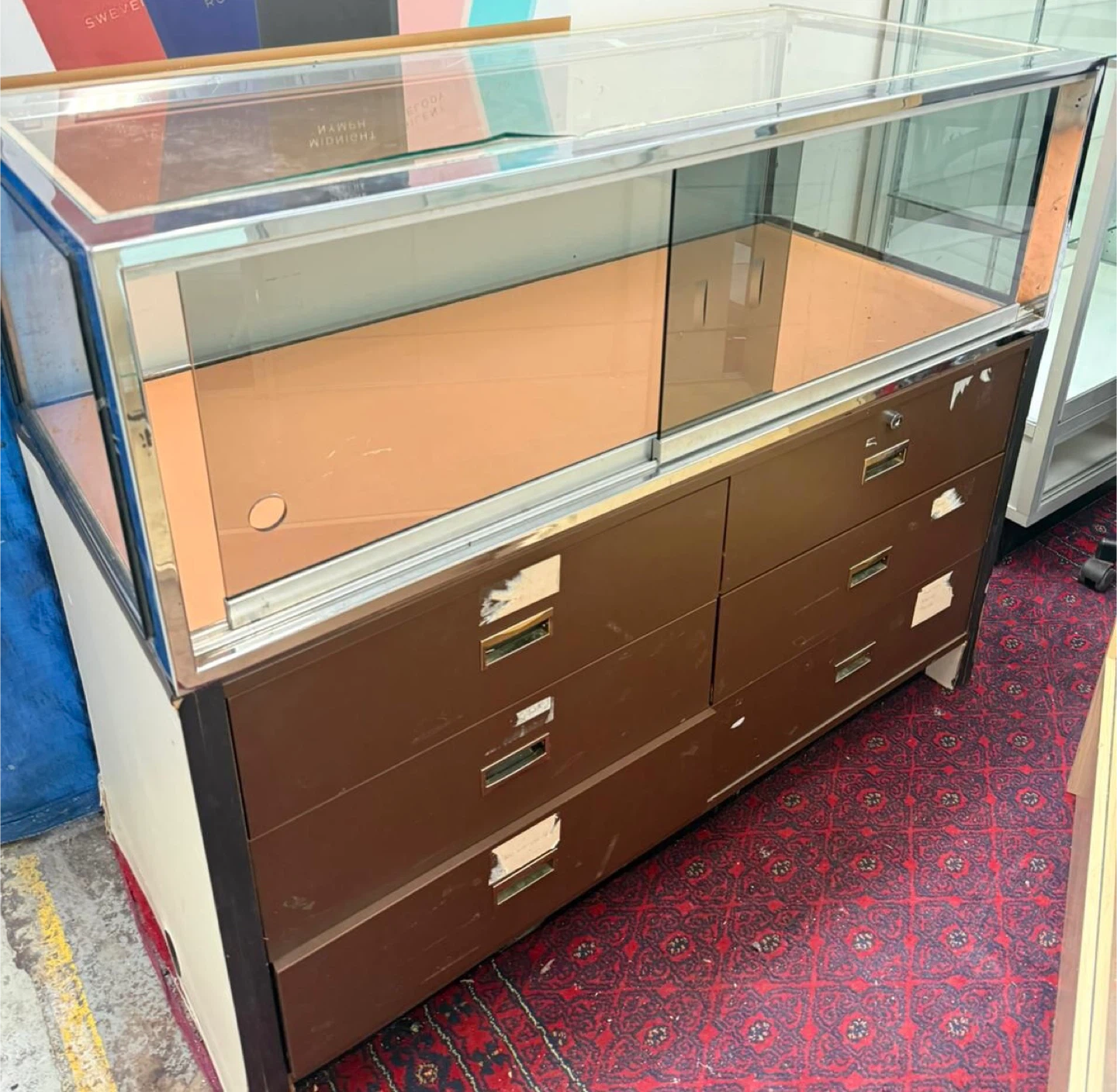 Glass display case with chrome frame