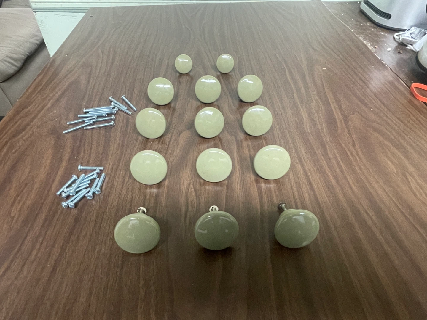 Olive green ceramic knobs.