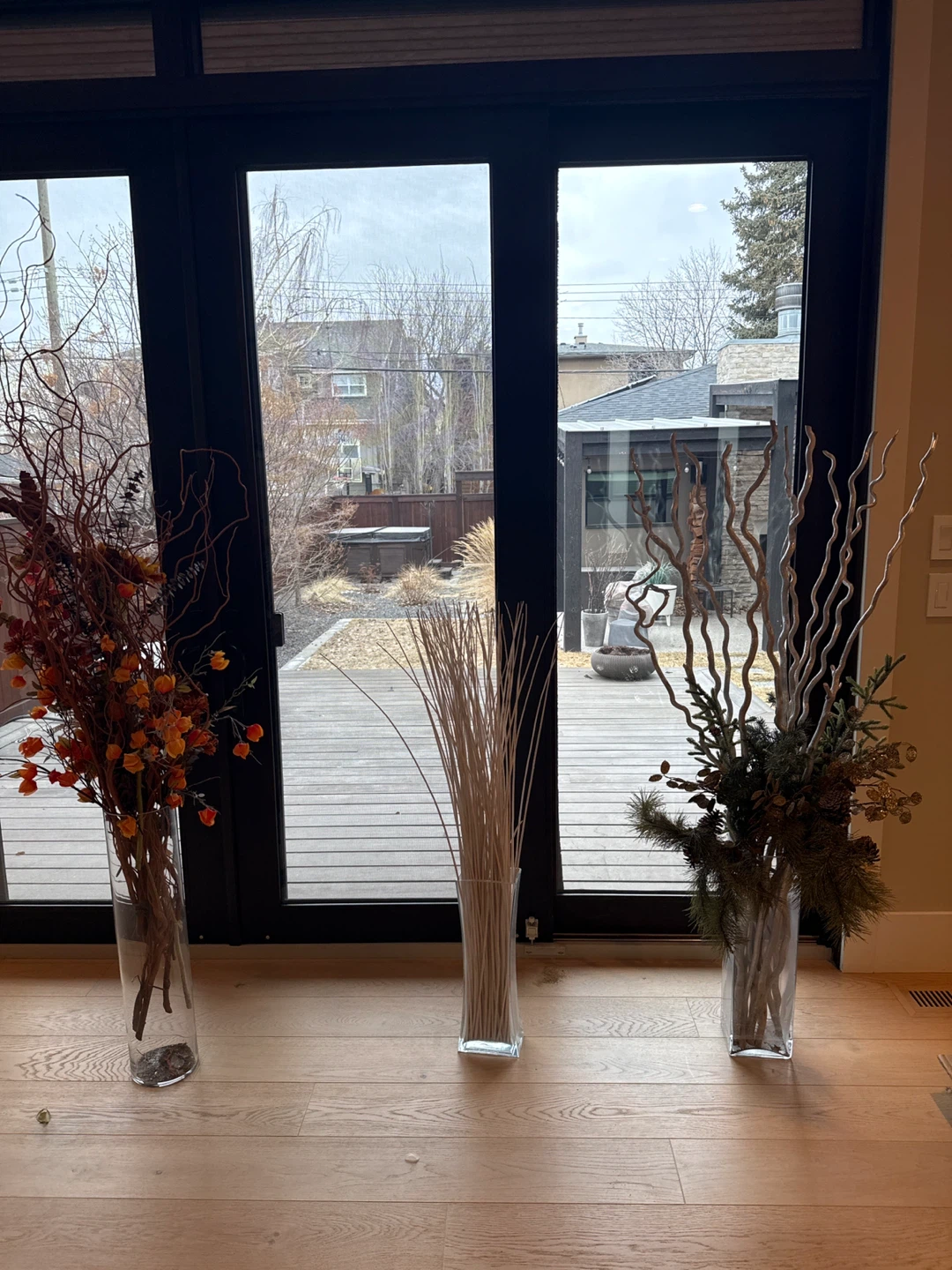 Decorative Branches and Greenery Arrangement in Glass Vase