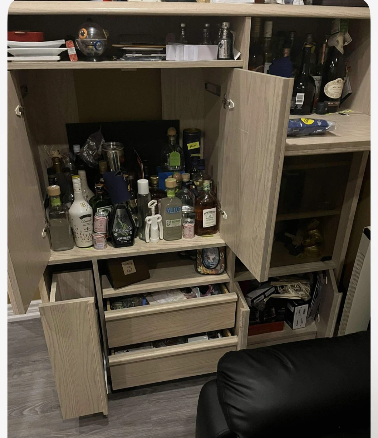 Light Wood Bar Cabinet with Glassware and Liquor Bottles - photo 2