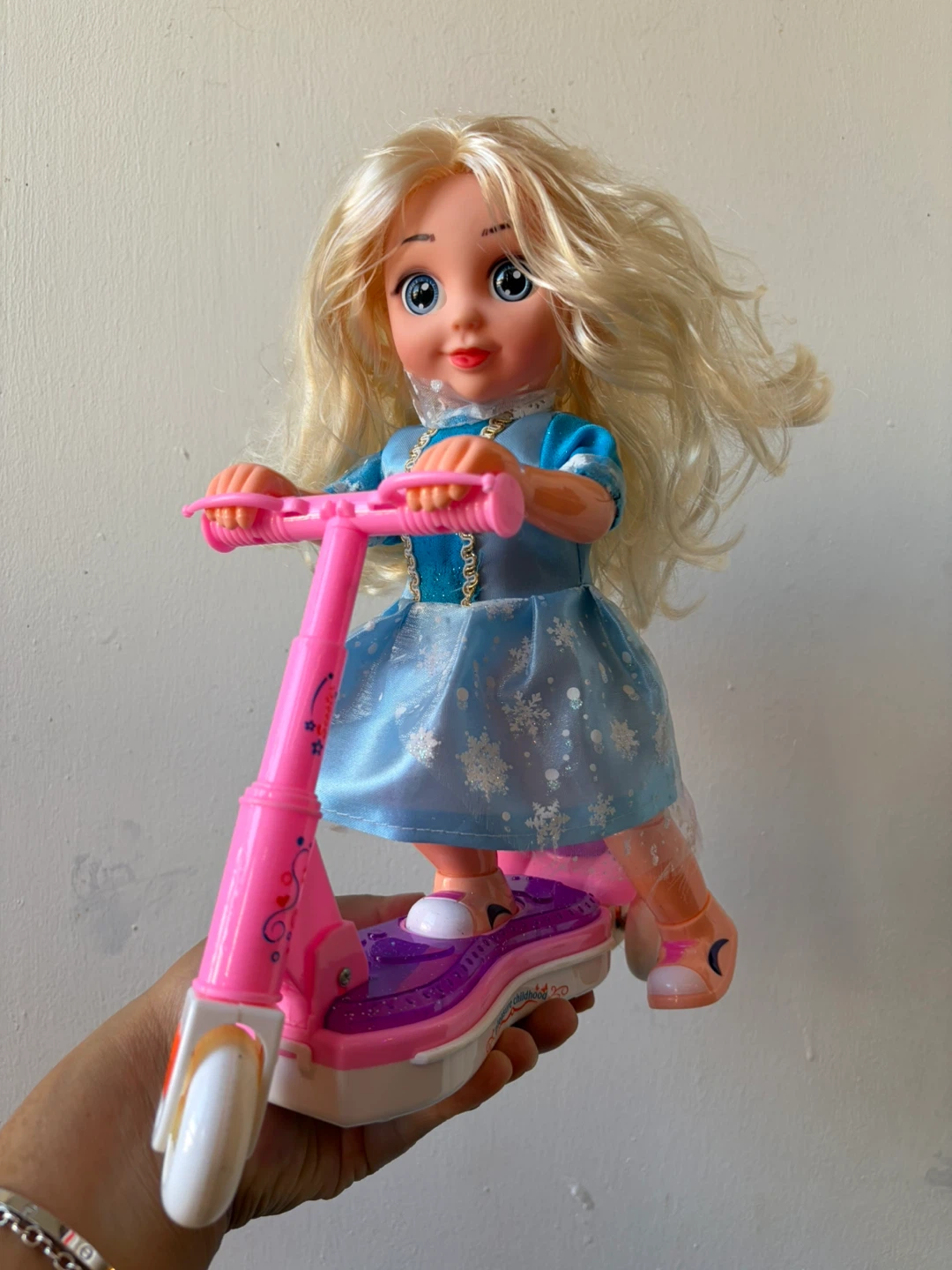 Singing(frozen song) doll and moving scooter