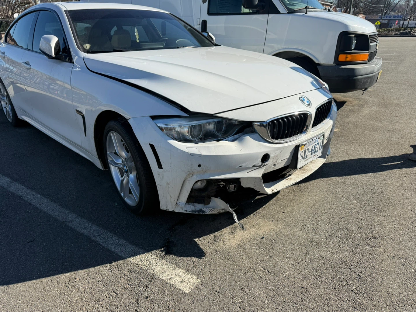 White BMW Damaged Front Bumper
