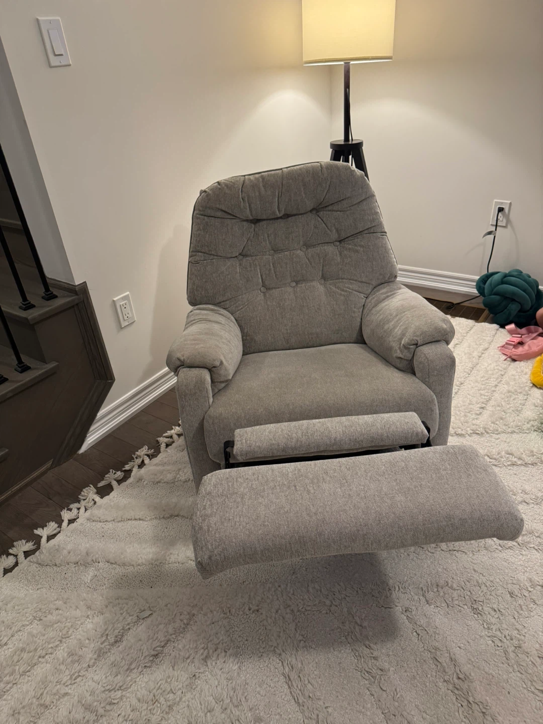 Grey upholstered recliner chair