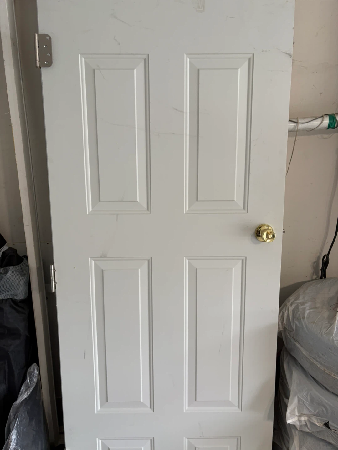 White 4-Panel Exterior Door with Gold Knob