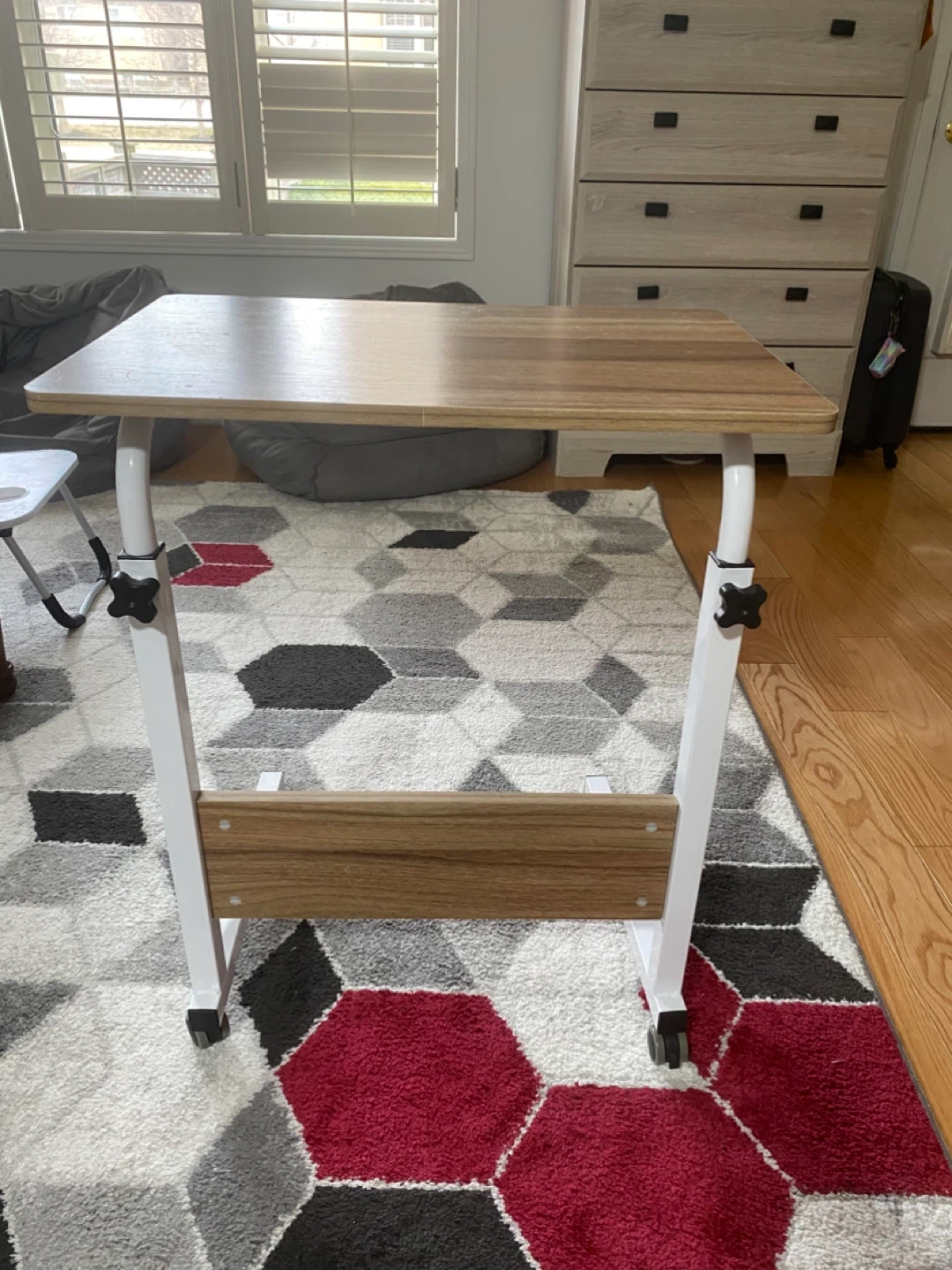 Side table with adjustable heights and wheels ..