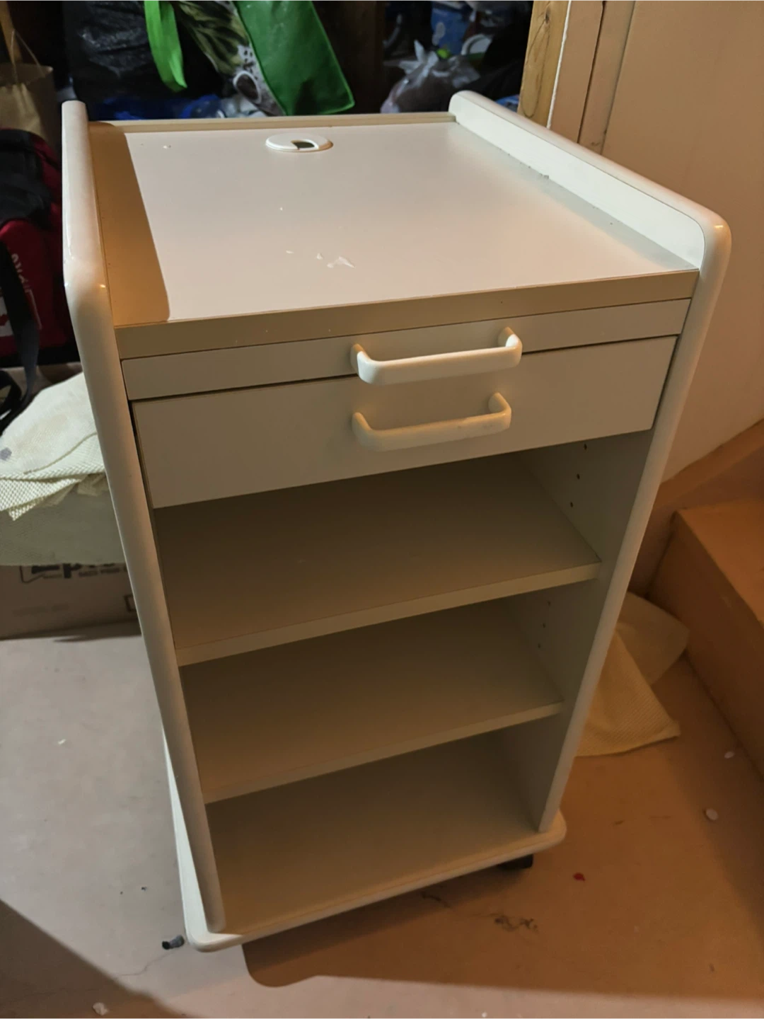 White rolling utility cart with drawer and shelves