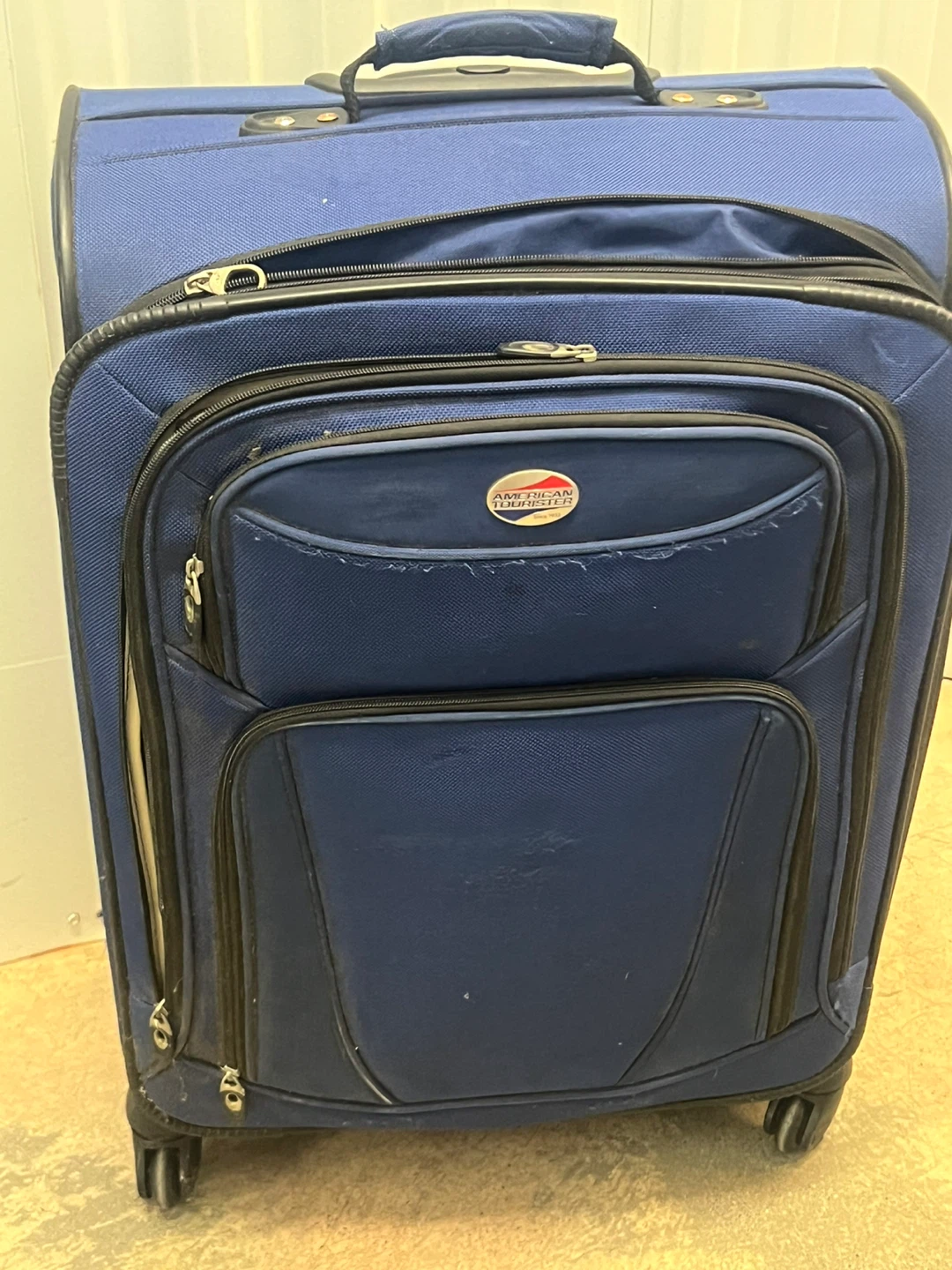 American Tourister Blue Rolling Suitcase