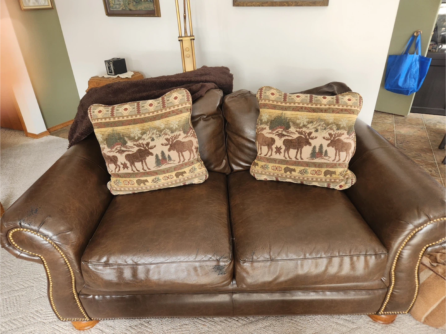 Brown Genuine  Leather Loveseat with Moose Pillows