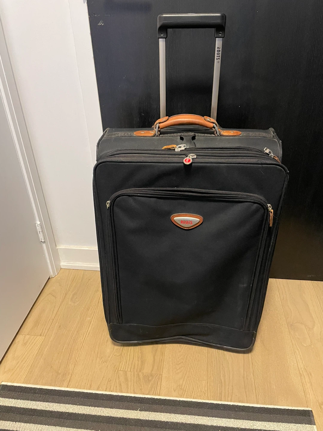 Roots Black Rolling Suitcase