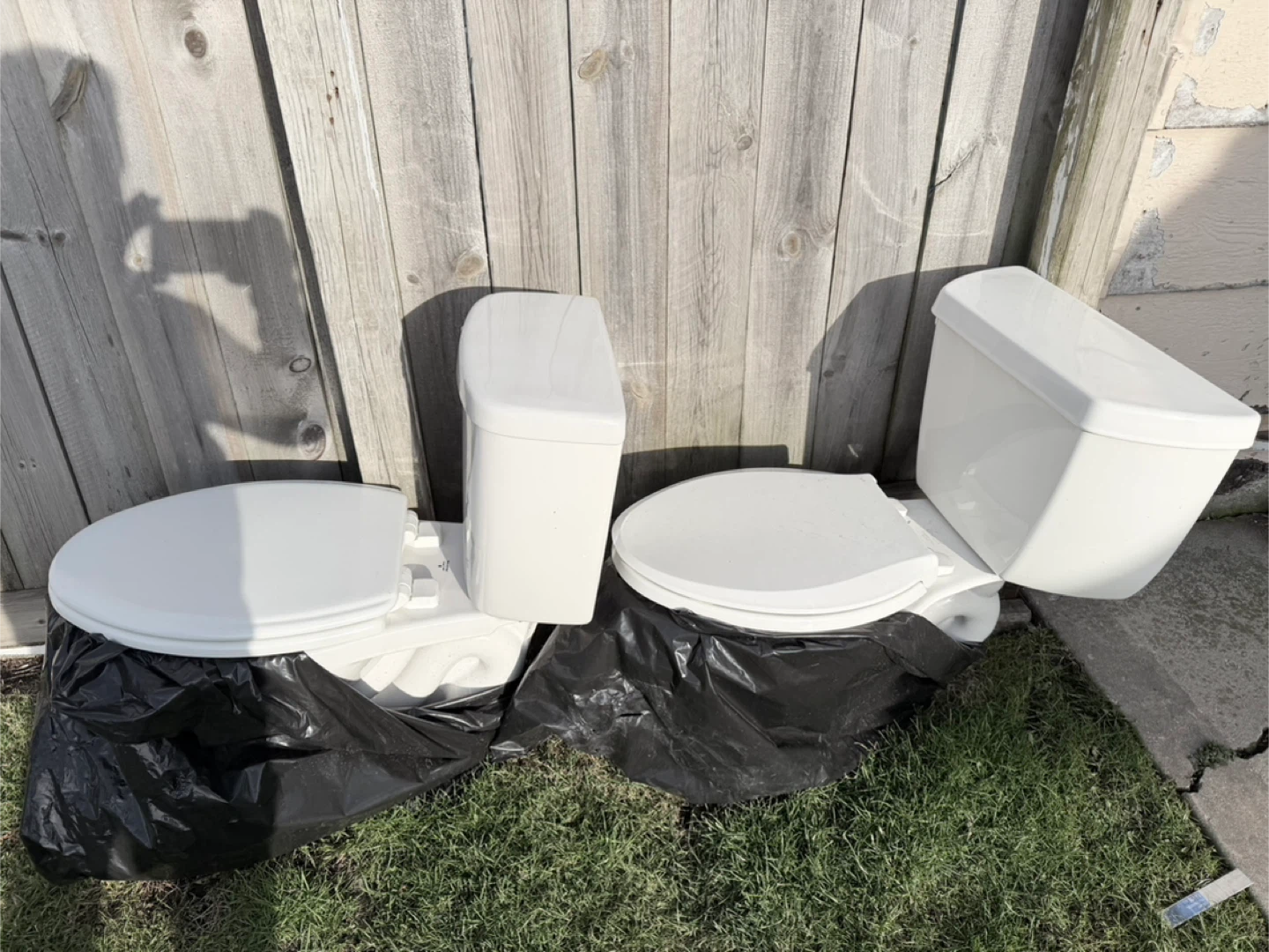 Two white toilets $70 per piece