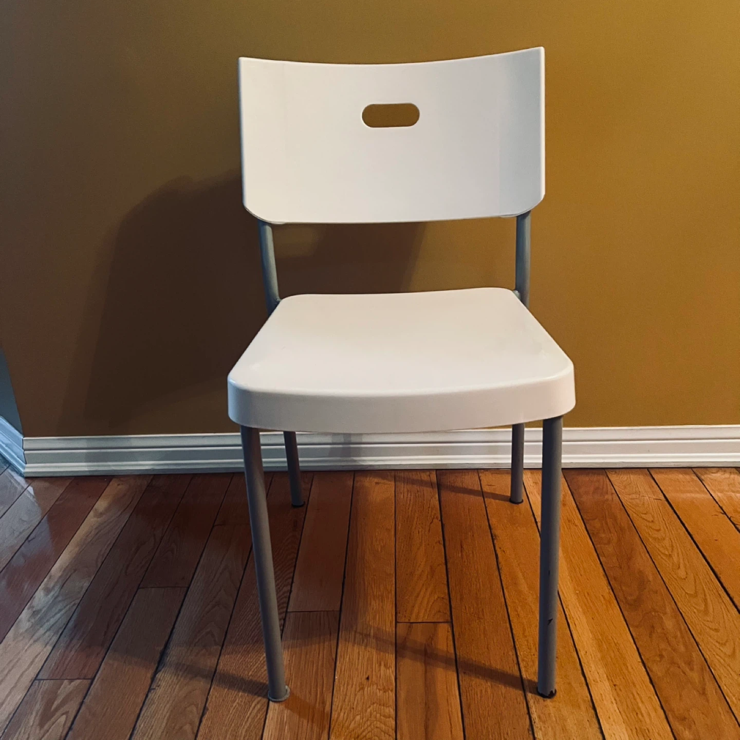 White Plastic and Metal Folding Chair