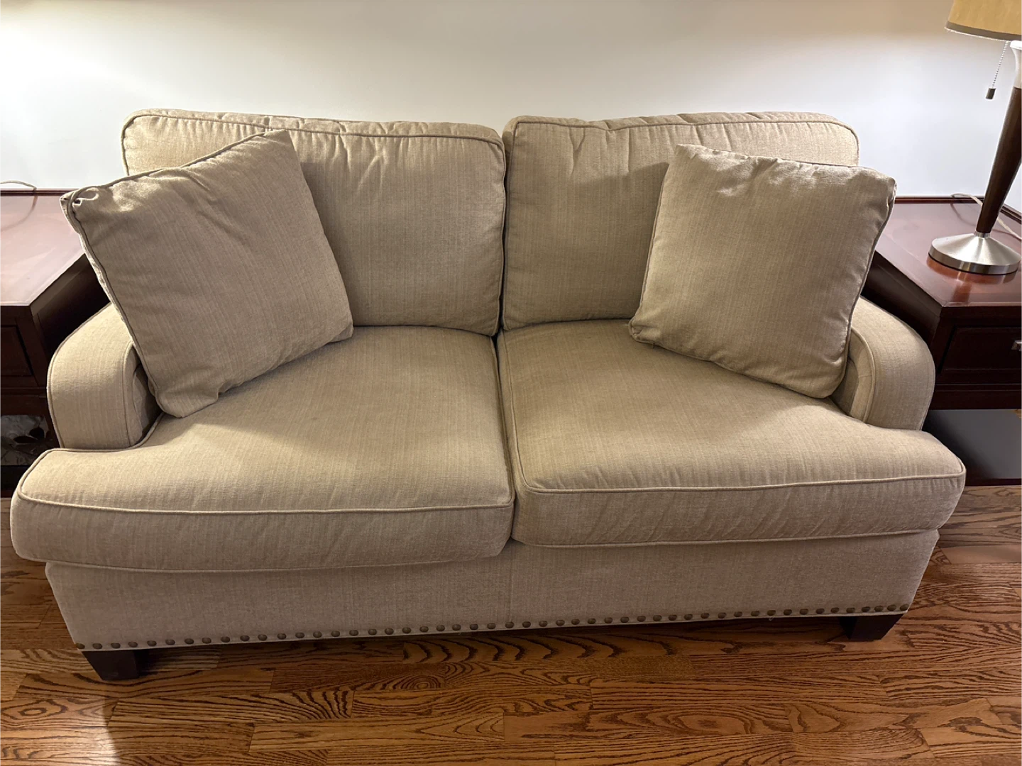 Two-seater sofa with accent pillows