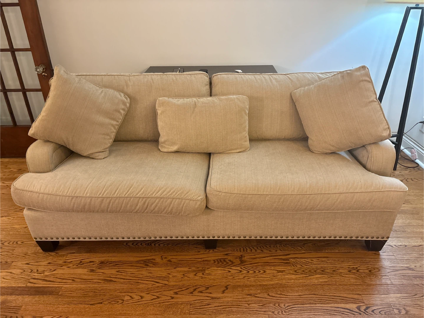 Beige Upholstered Sofa with Accent Pillows