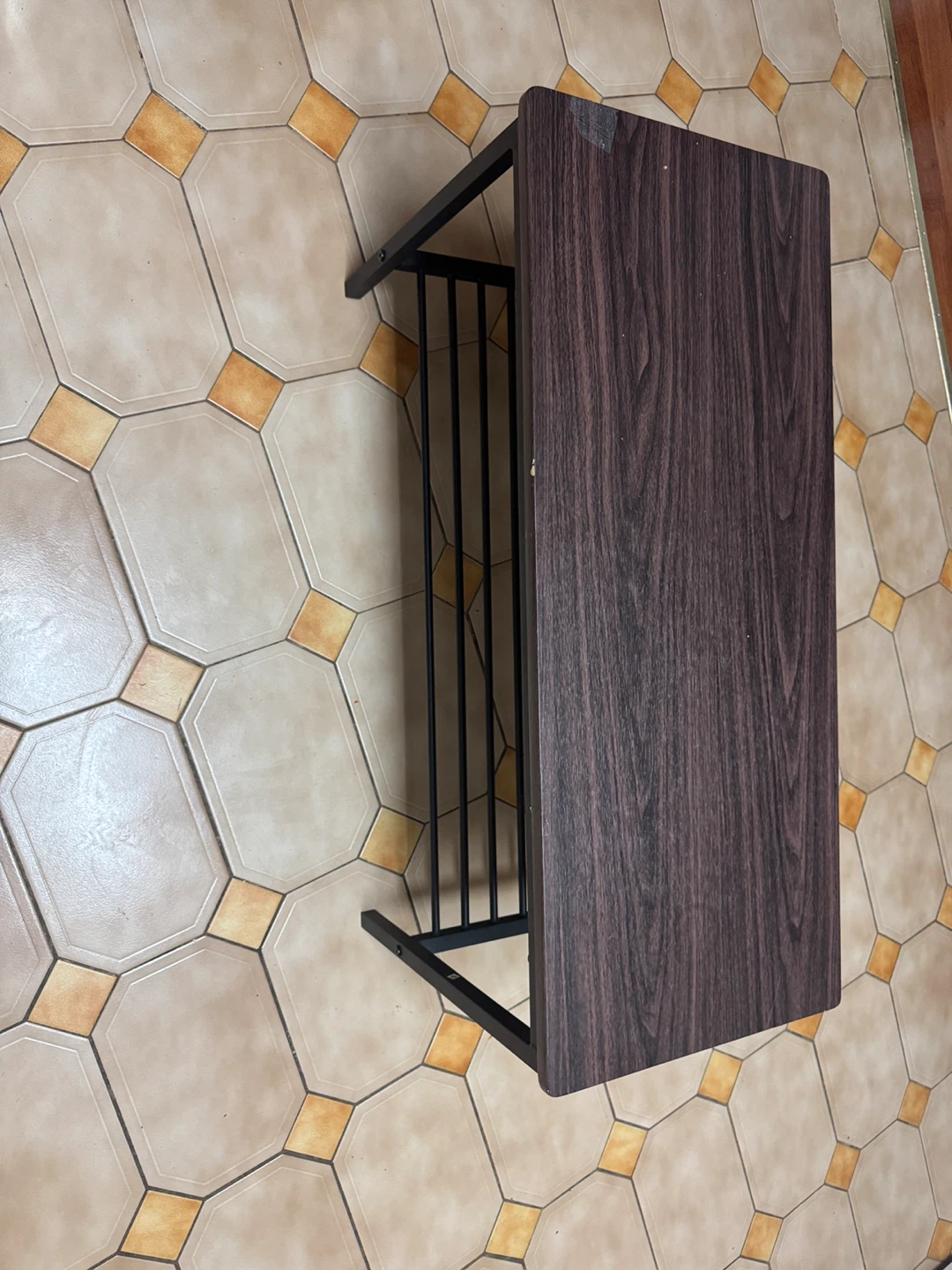 Small table with shelf. Dark wood look top, black metal frame.