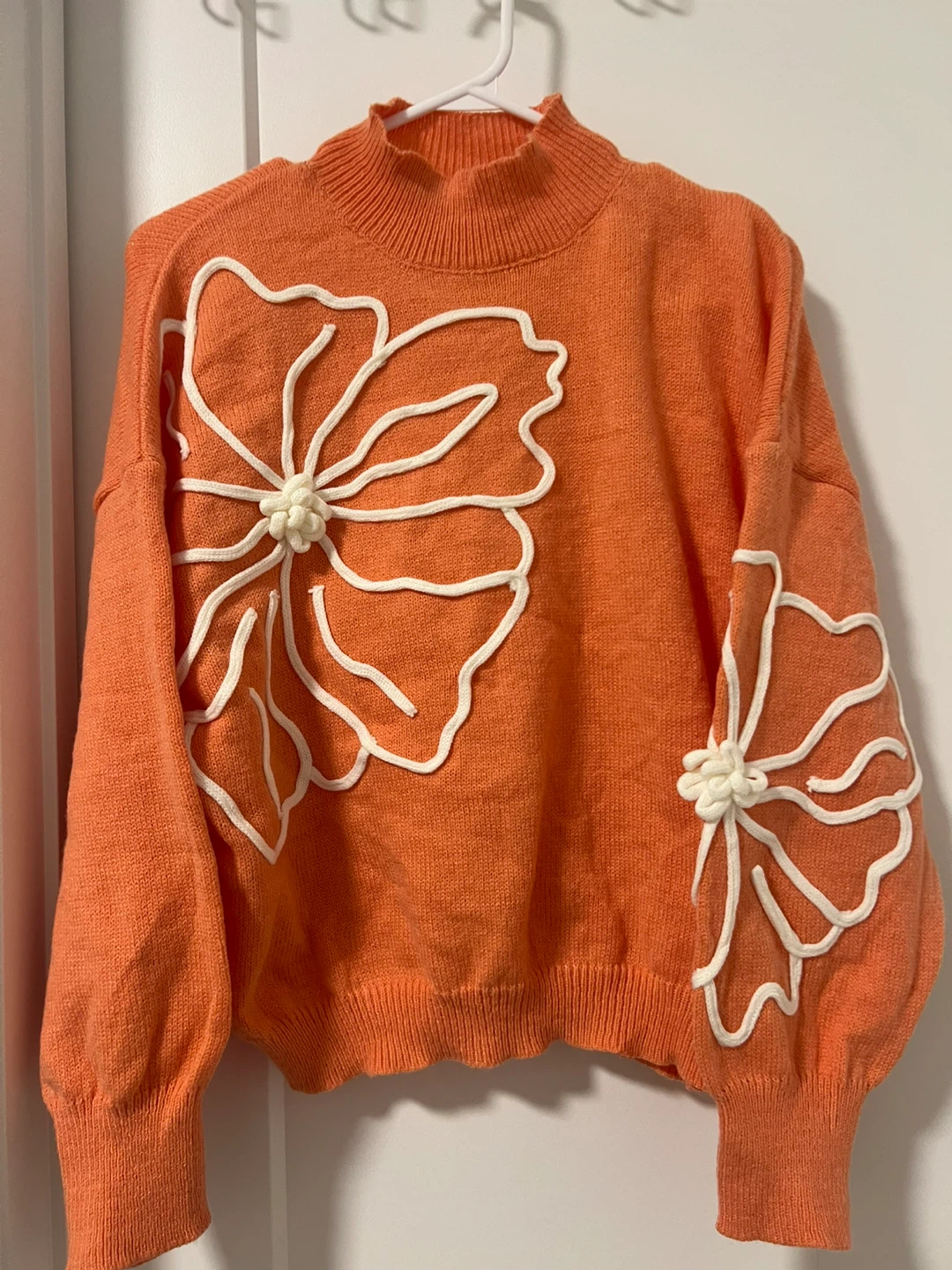 Orange Mock Neck Sweater with White Floral Appliqué