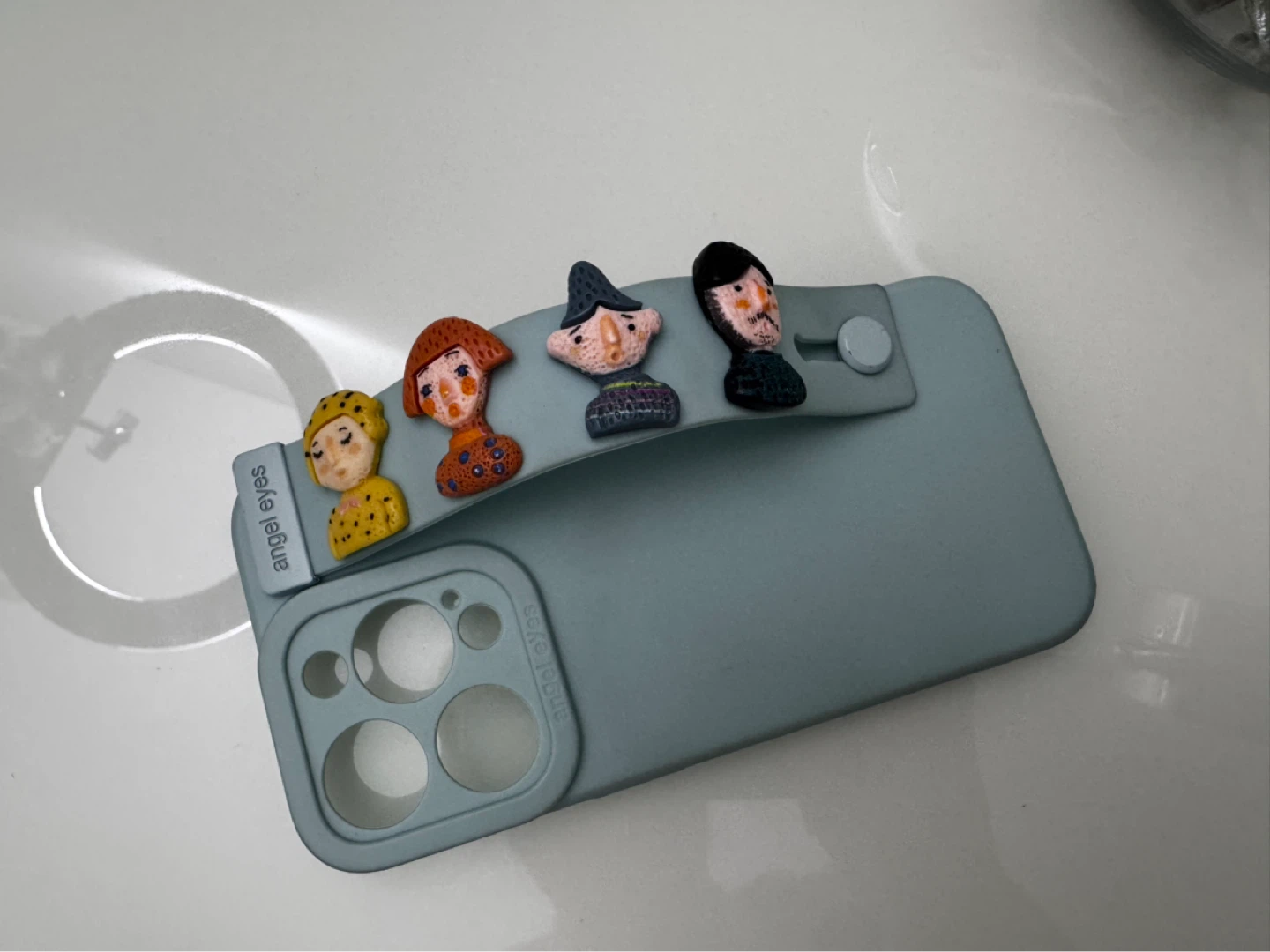 Light Blue iPhone 15 Pro Case with Four Character Charms - photo 2