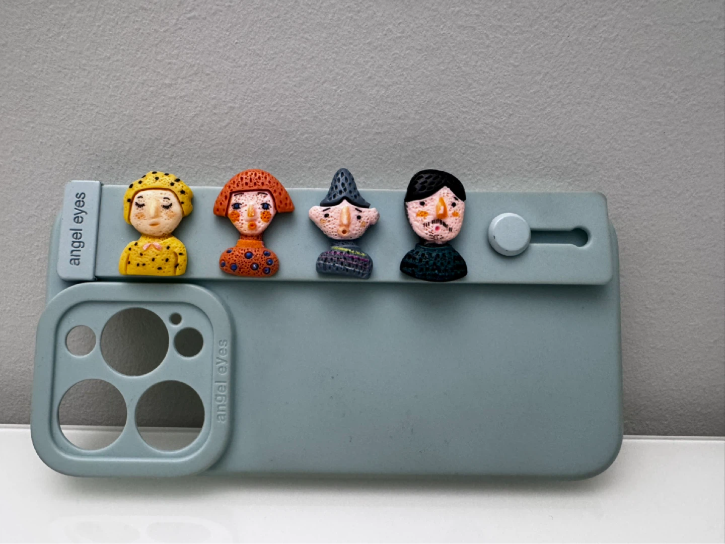 Light Blue iPhone 15 Pro Case with Four Character Charms