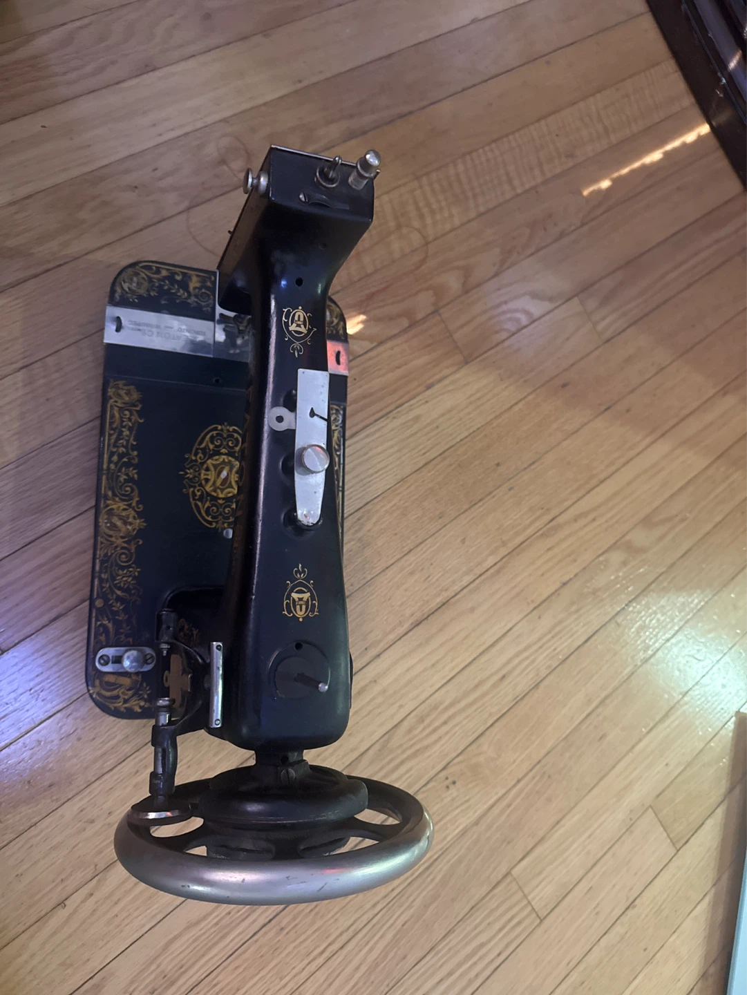 Eaton Black Sewing Machine with Gold Embellishments