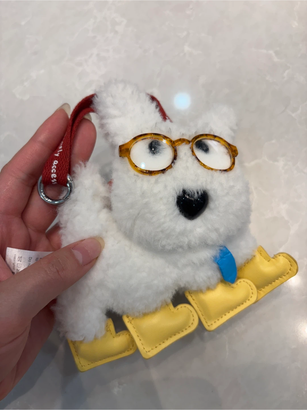 White fluffy dog plush keychain with glasses