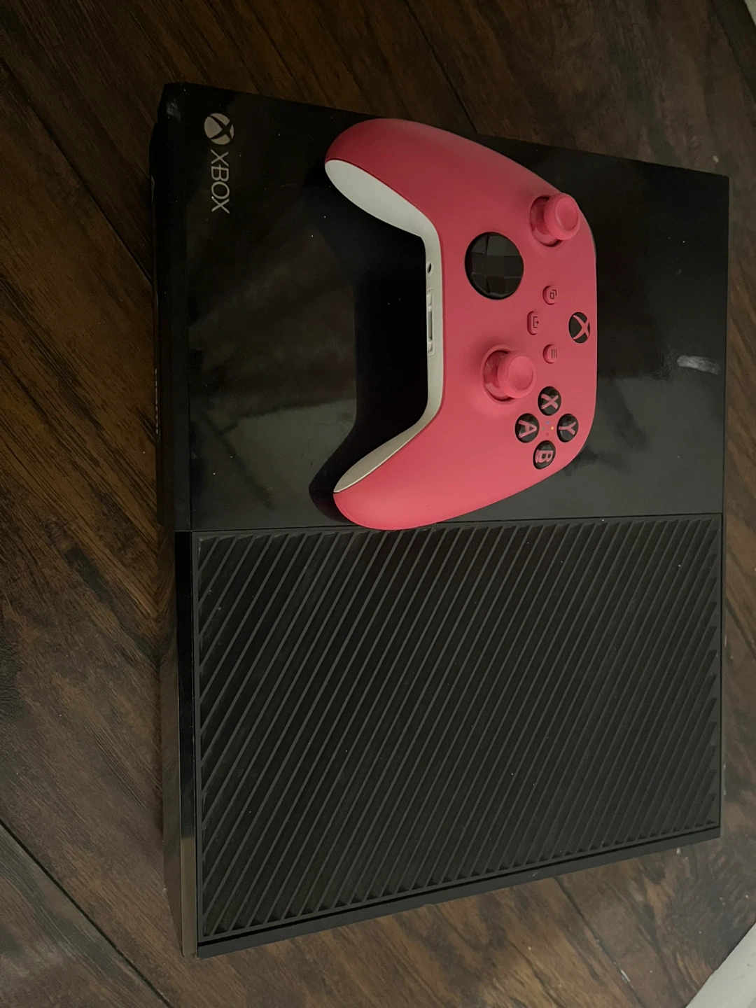 Black Xbox One Console with controller