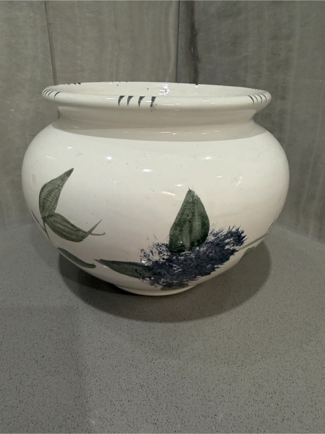 White ceramic planter with floral design