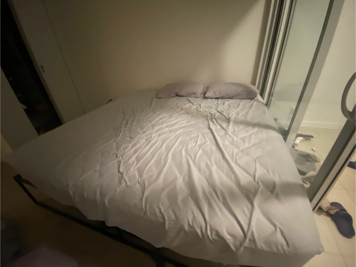 King size mattress with metal bed frame and bedsheets - photo 3