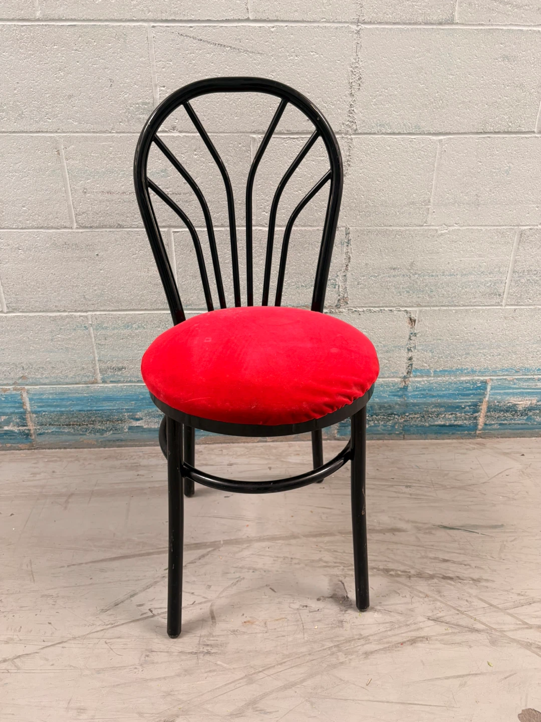 Black Metal Chair with Red Seat Cushion