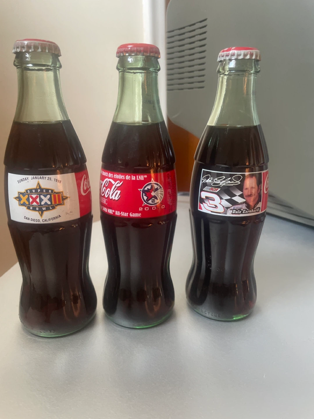3 coke collectible bottles