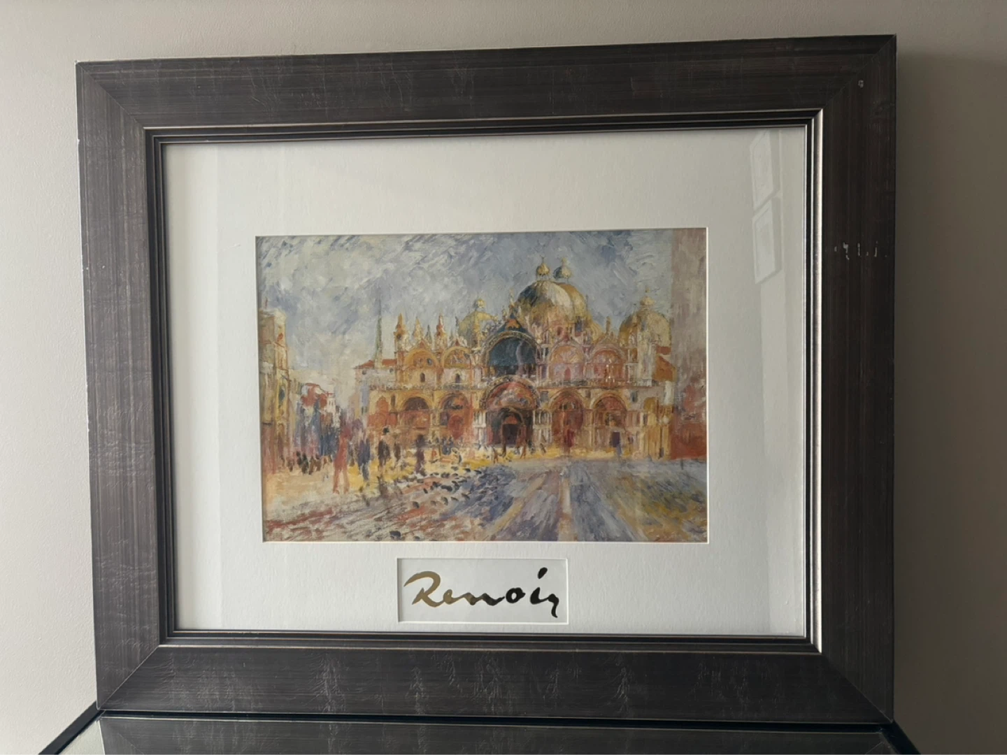 Framed Renoir print under glass