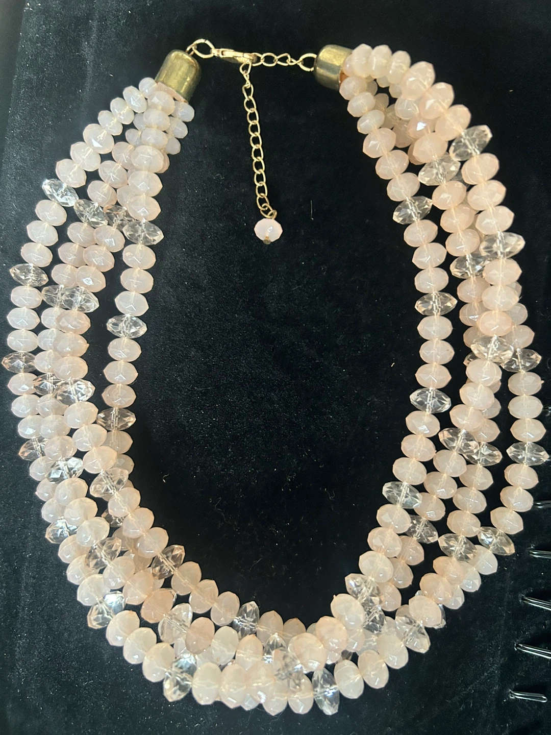 Multi-strand beaded necklace with clear and pink beads